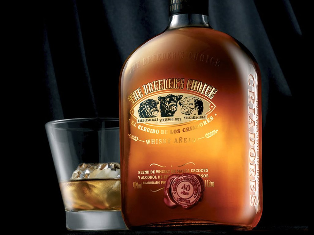 Rustic cabin in a golden field at sunset