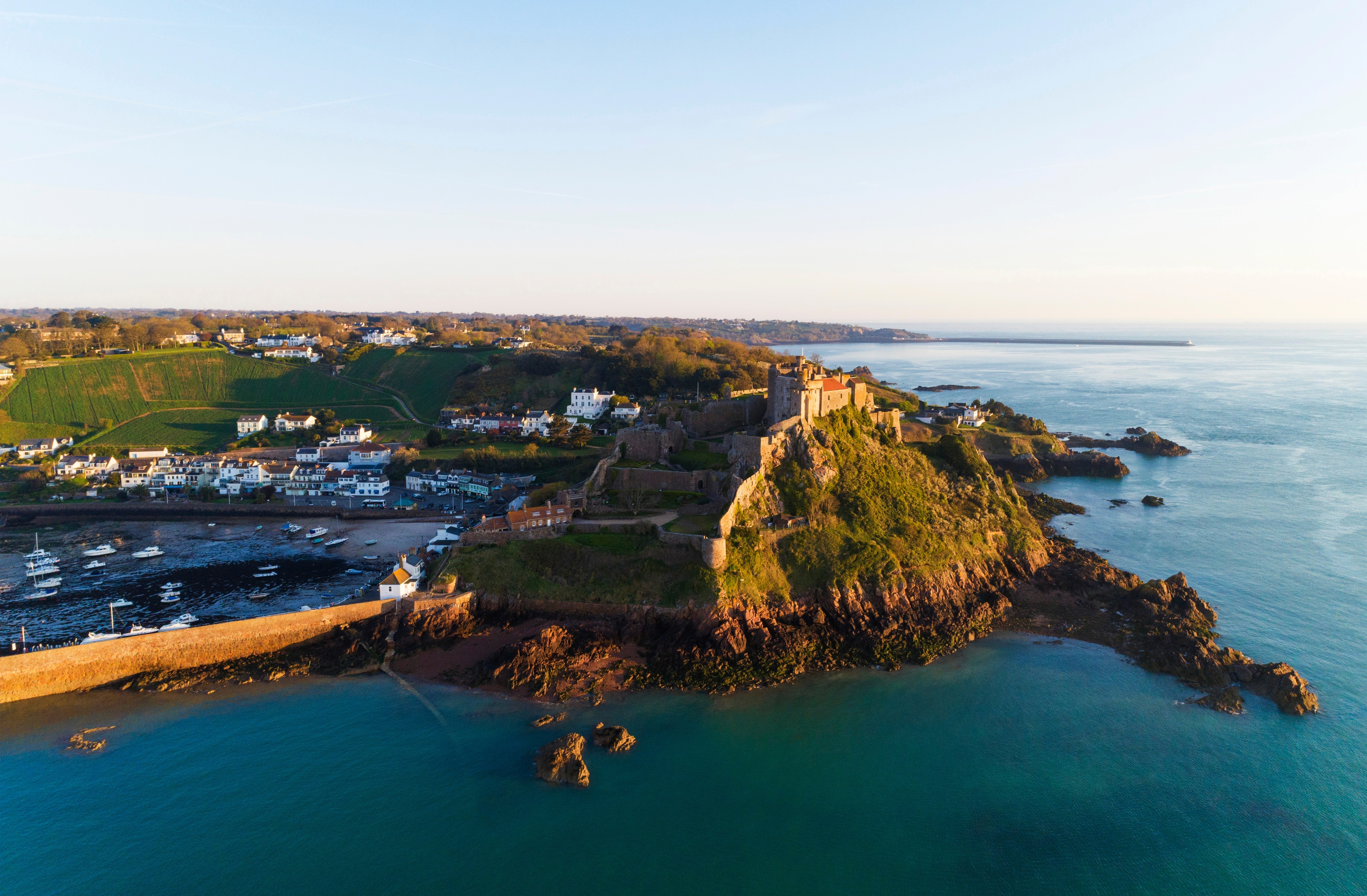 Mont Orgueil Castle overlooking Gorey Harbour in Jersey, symbolising stability, clarity, and the well-regulated international environment that underpins offshore company formation and banking.