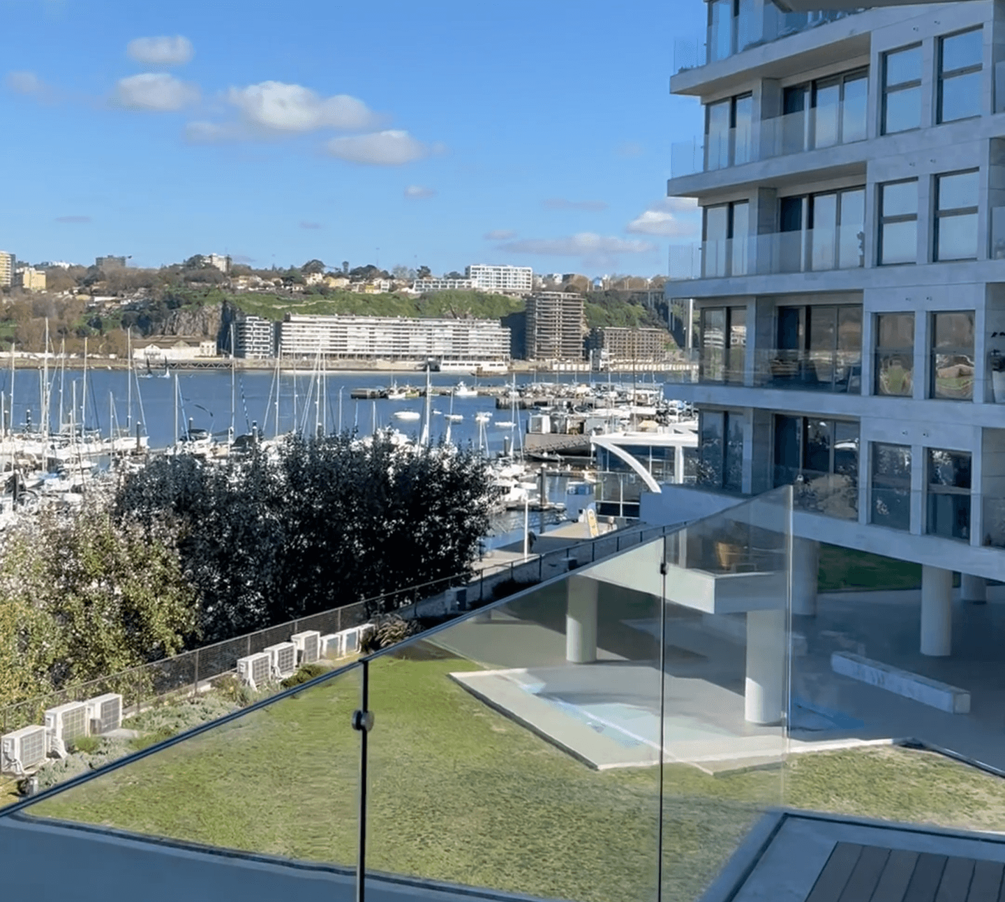Modern residential development overlooking a marina in Portugal, relevant to buying property as a foreign buyer