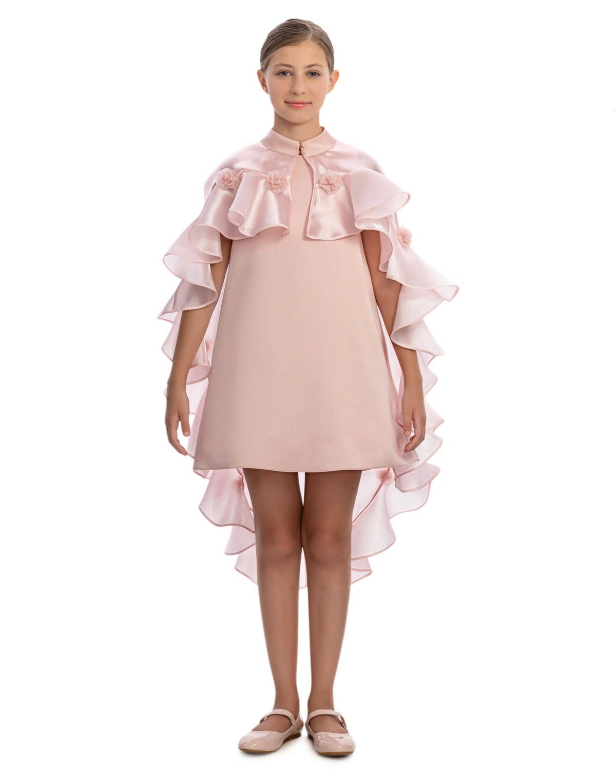 Pink dress with ruffled sleeves and hem on a white background