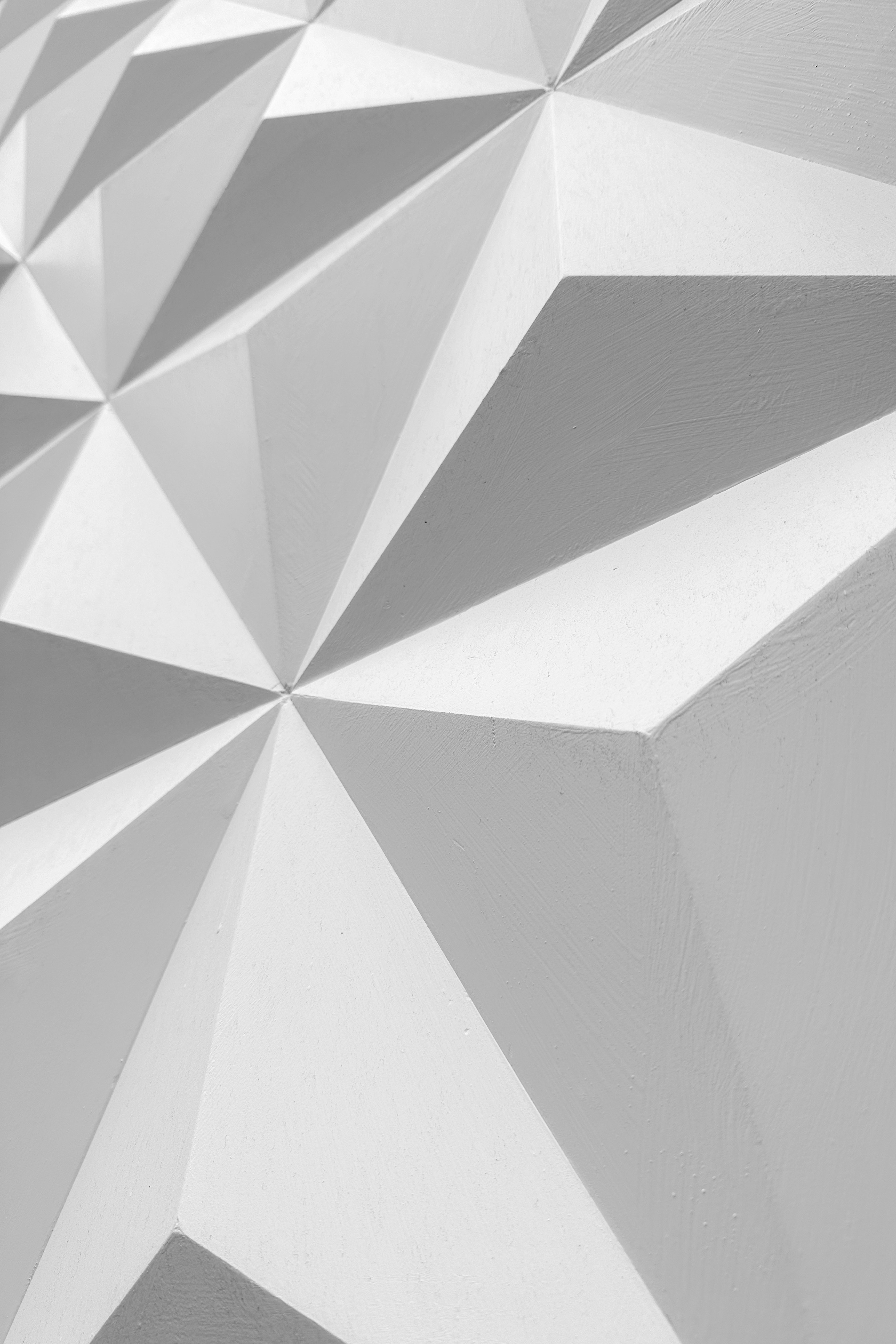 a close up view of a white wall