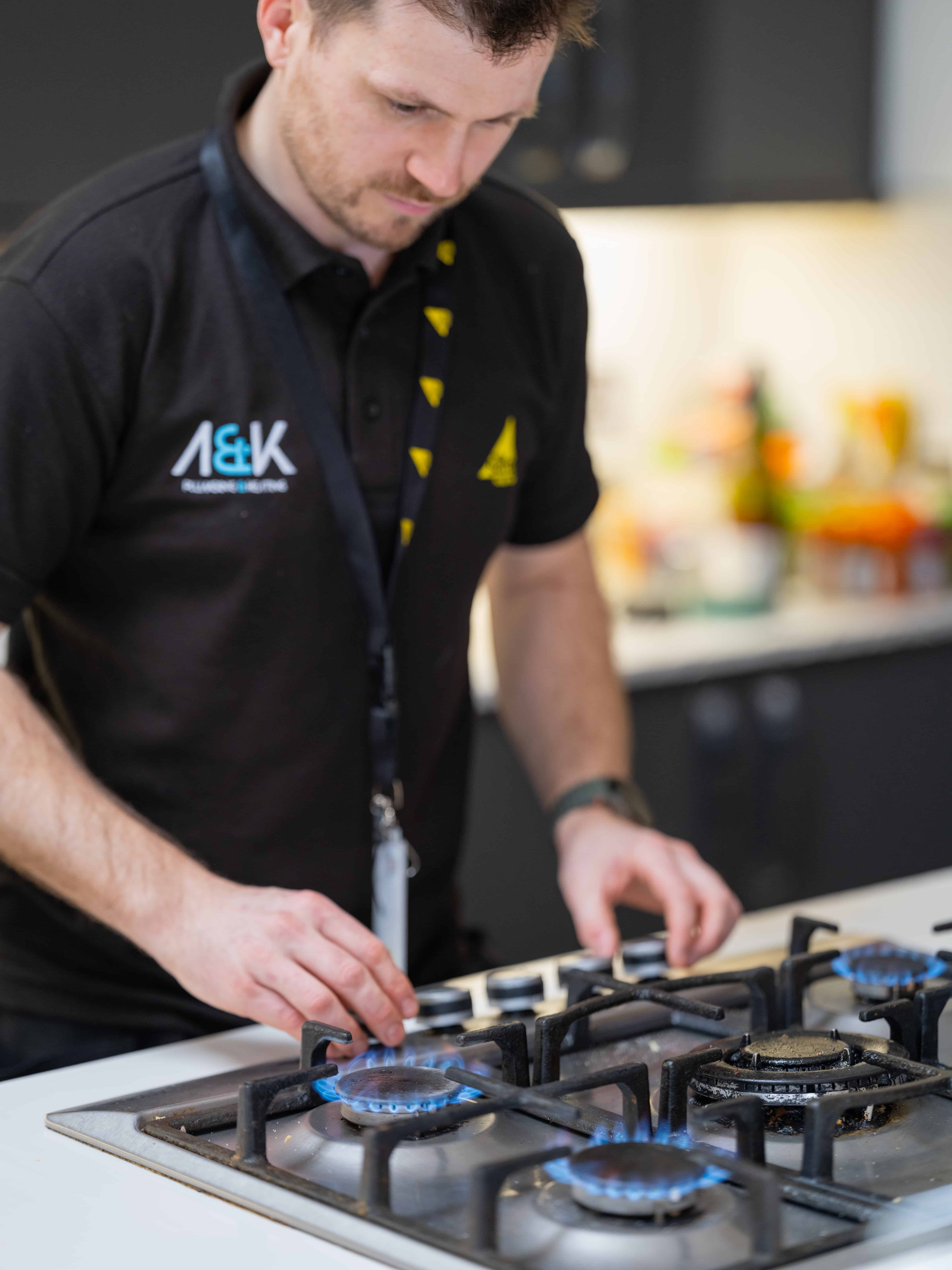 Gas safe registered heating engineer carrying out a gas safety check in north london