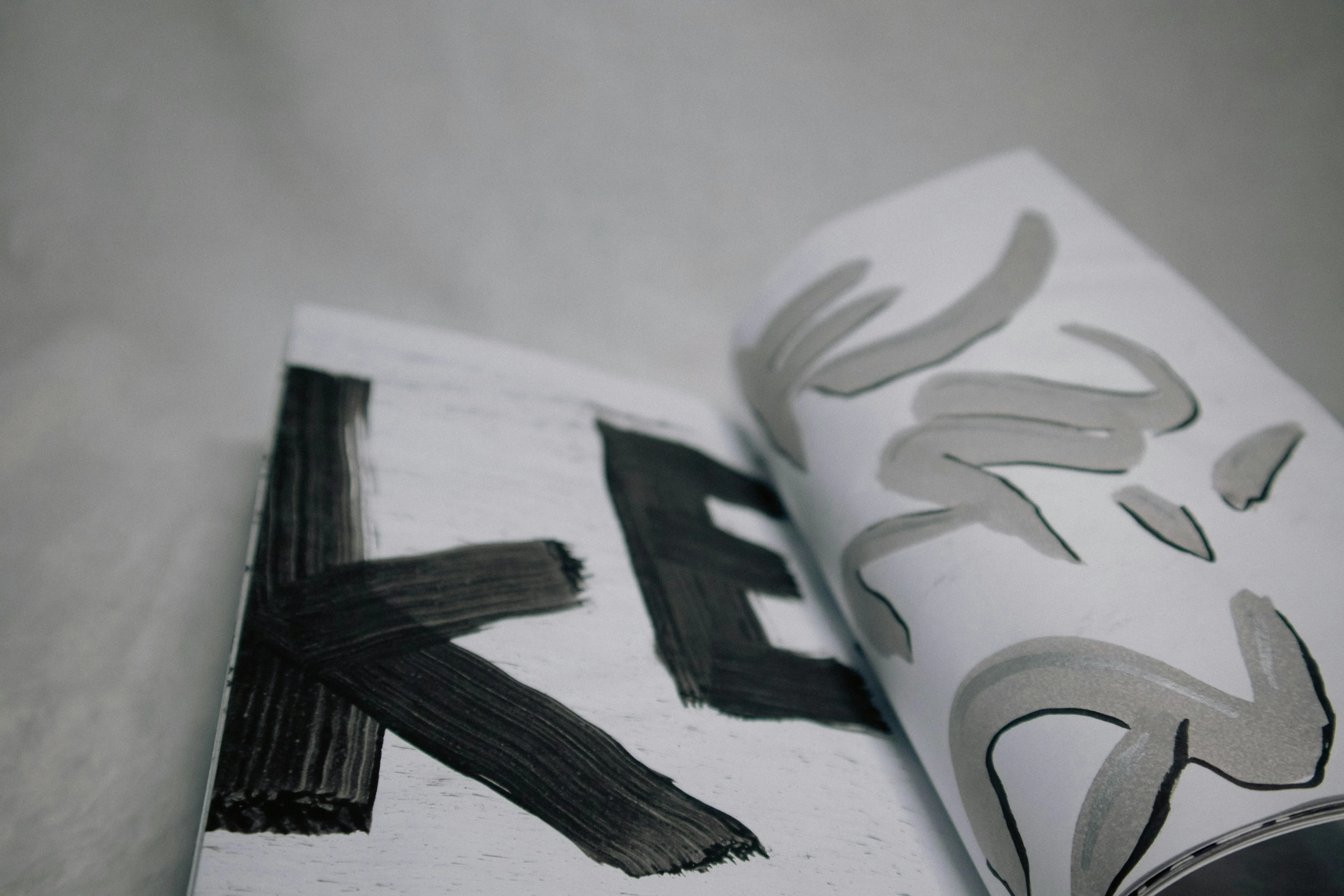 A white book with black and white designs on it