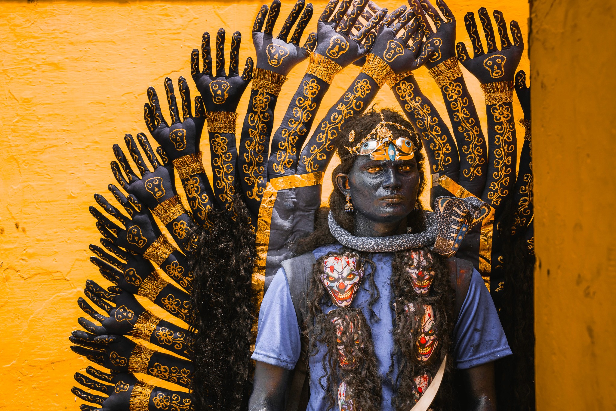 The Indigo Gaze - The "Chamundi" form, captured in the silence before the frenzy. The deep indigo pigment signifies the infinite nature of the deity, while the yellow halo of hands represents omnipresence.