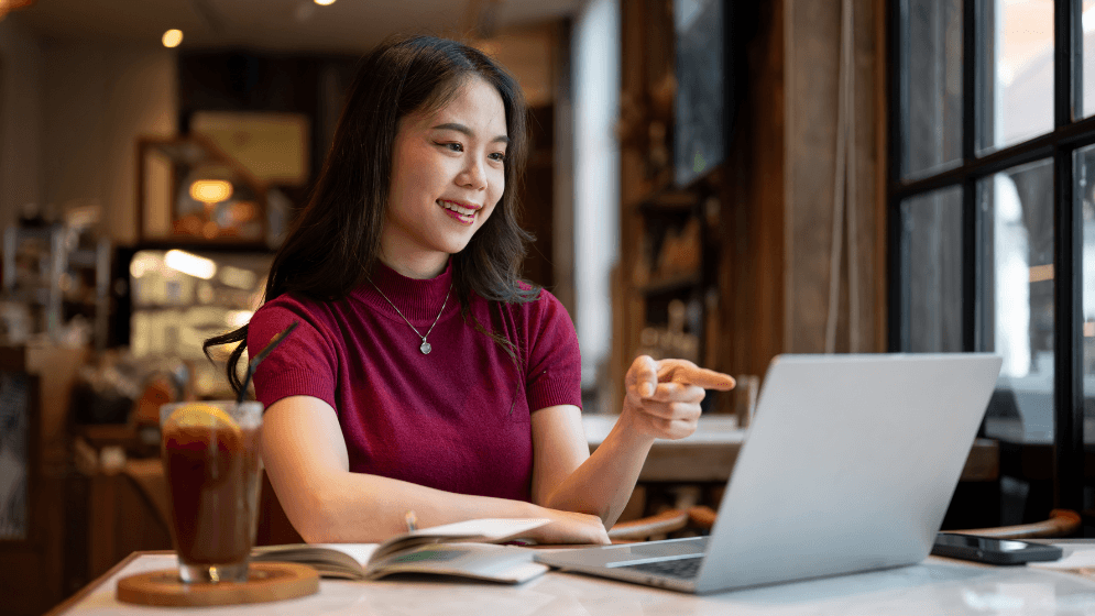 Malaysian business owner on her laptop