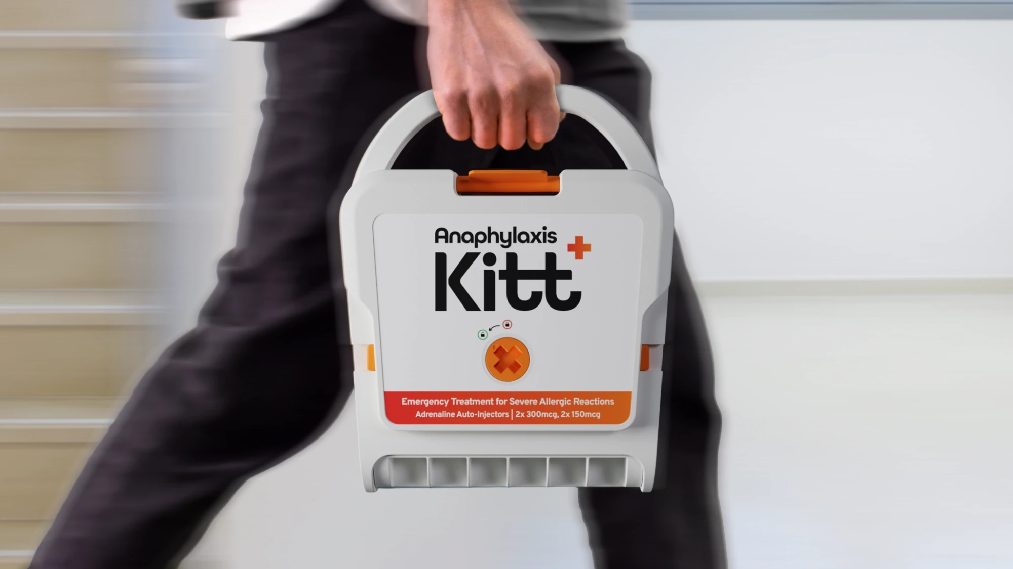 Person carrying the Kitt medical device, demonstrating its portable design, form factor, and ease of transport.
