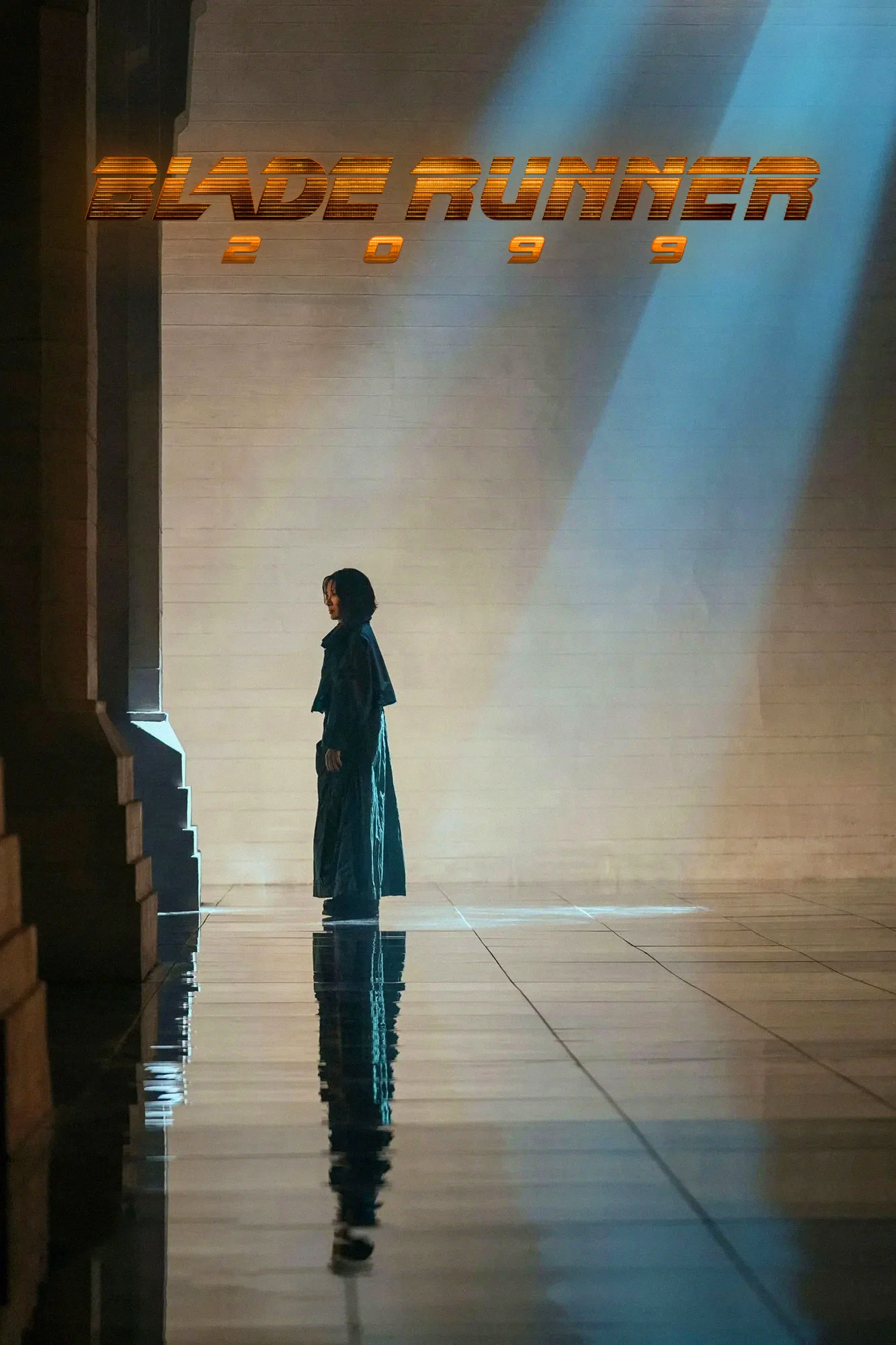 A lone figure stands in a dimly lit, expansive hallway with light streaming in from above, casting a long reflection on the polished floor, with the words "Blade Runner 2049" illuminated on the wall.