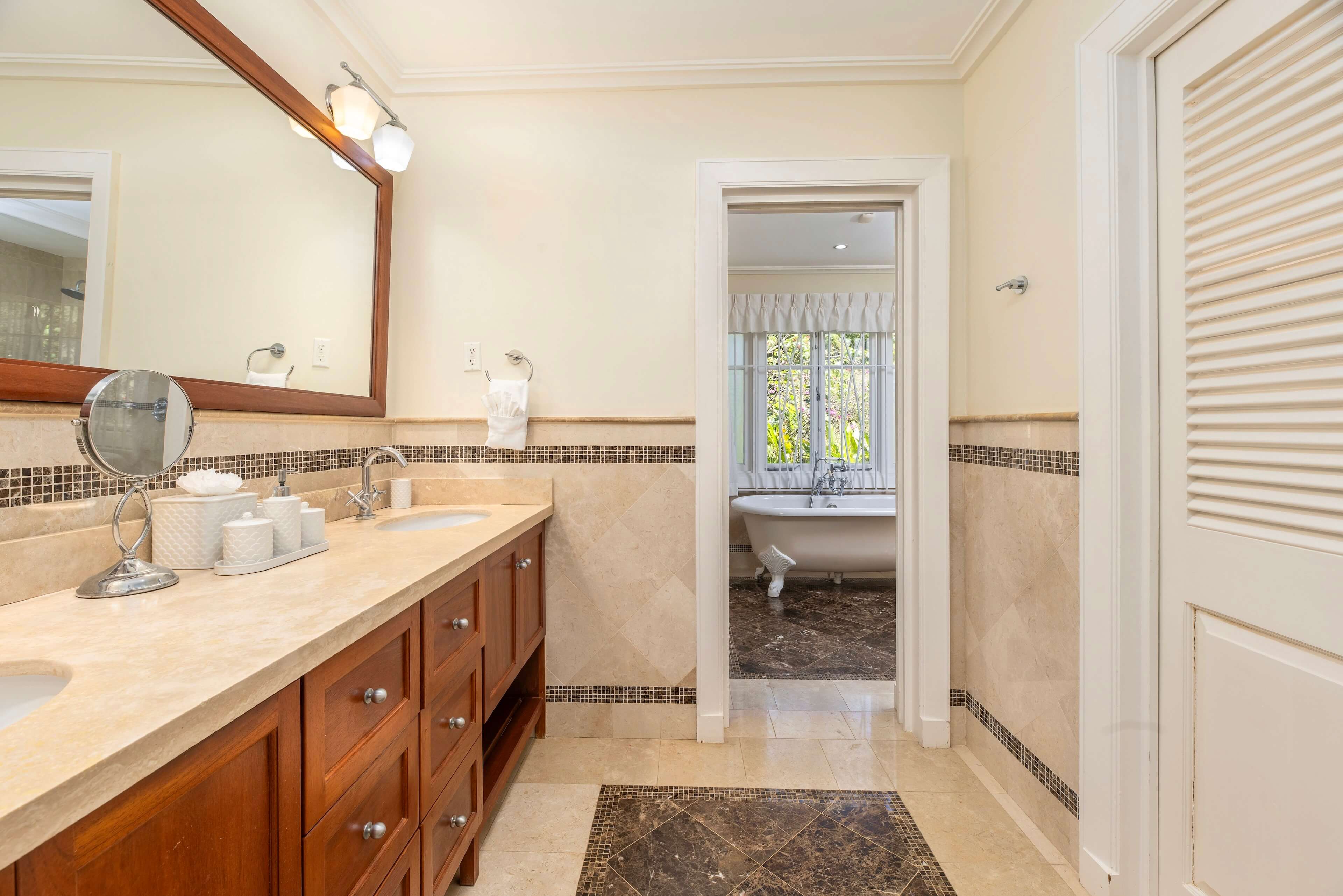 Spacious bathroom with double vanity and neutral decor