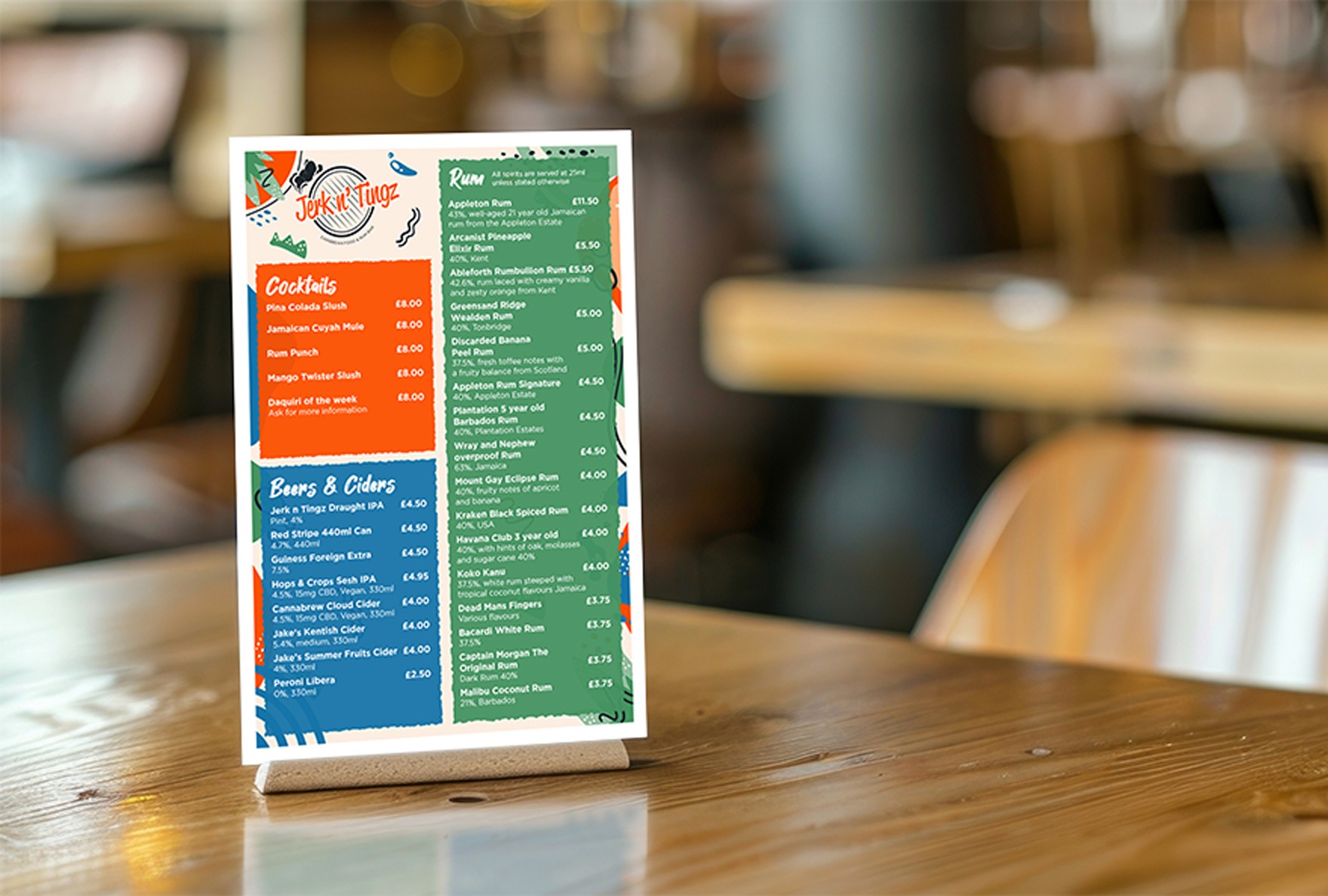 Freestanding vibrant drinks menu on wooden table surface with a blurred background