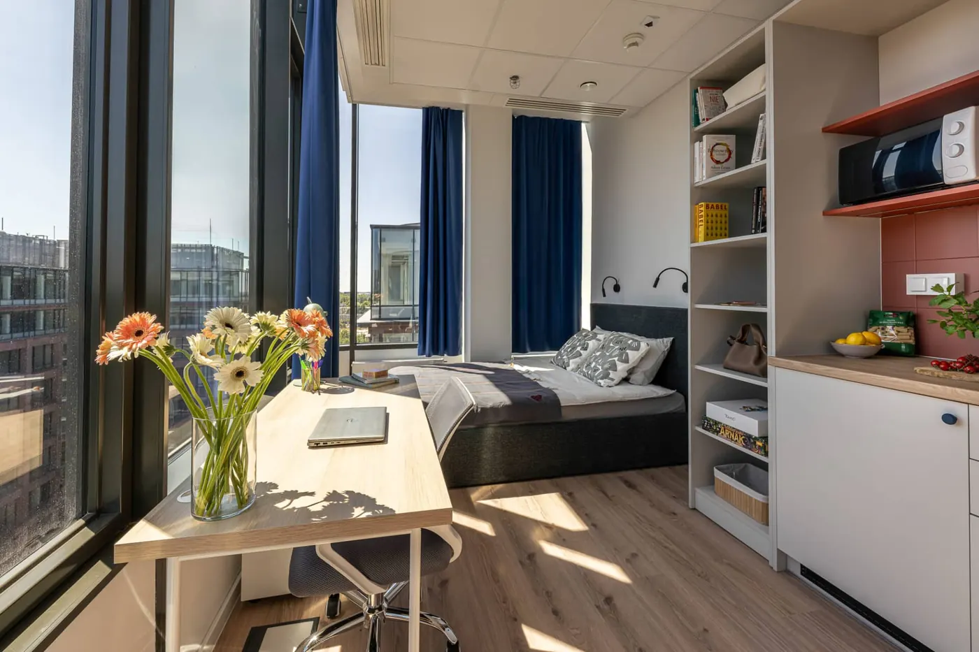 Large student studio in Warsaw with private kitchen, study desk and sleeping area