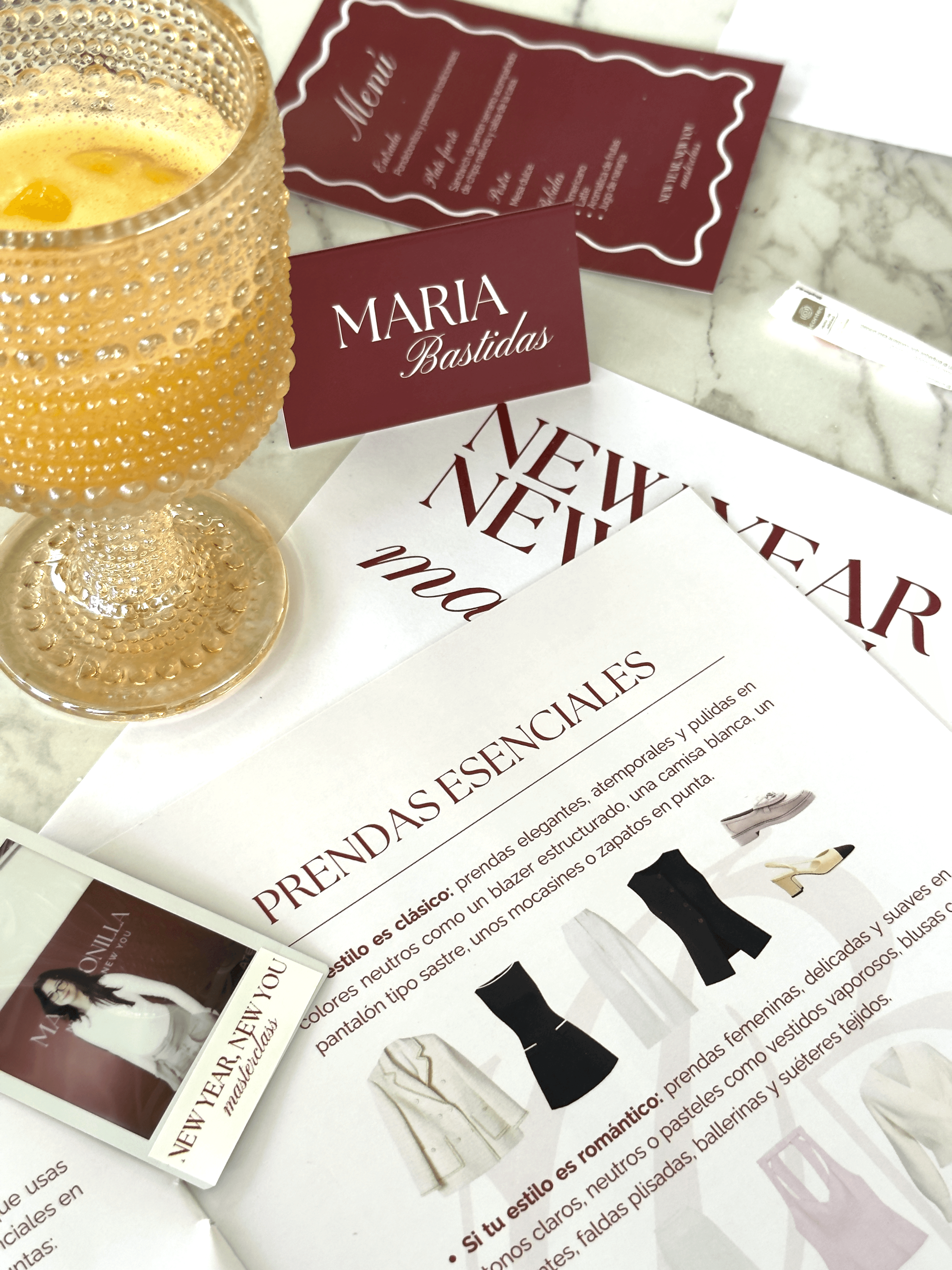 clear drinking glass with coffee on top of white table