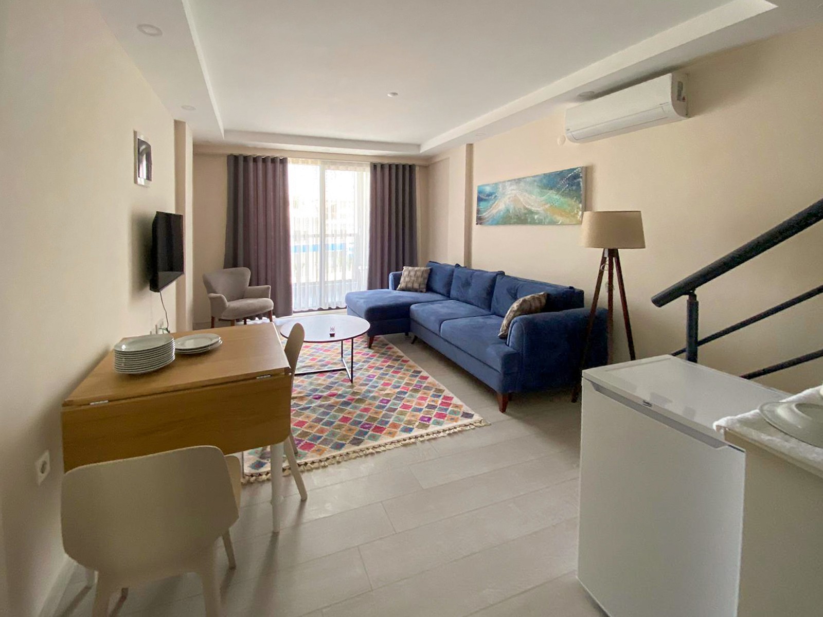 Duplex 1 bedroom apartment living room interior at Zen Garden Suites Side Antalya