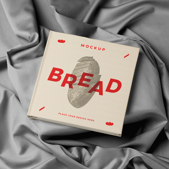 Bread packaging book mockup on gray fabric.