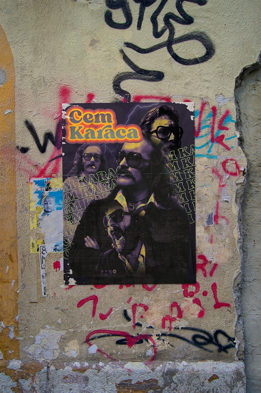 Vintage music poster design for Cem Karaca showcasing distressed half-tone textures and retro typography pasted onto a gritty urban graffiti wall.