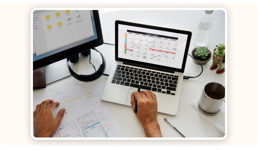 Person reviewing a schedule on a calendar