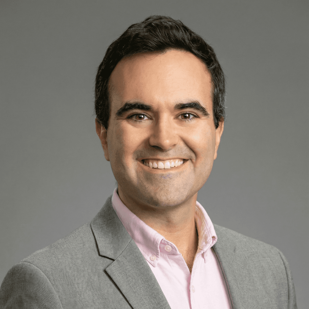 smiling woman in white and black checkered dress shirt