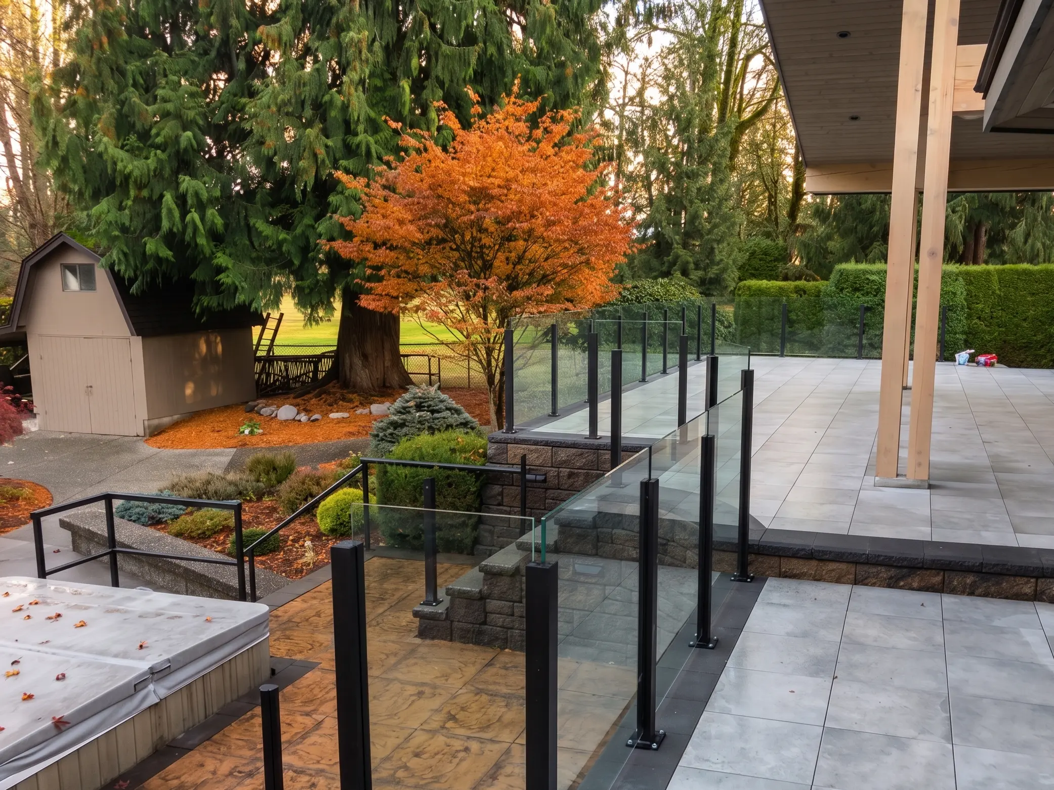 Comox glass railings framing an open water and marina view from a waterfront deck