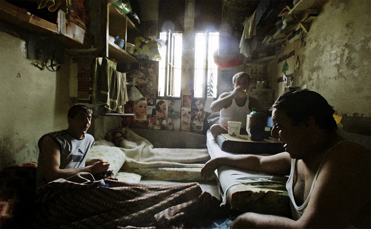 Inmates sit talking in a cell in Roumieh prison