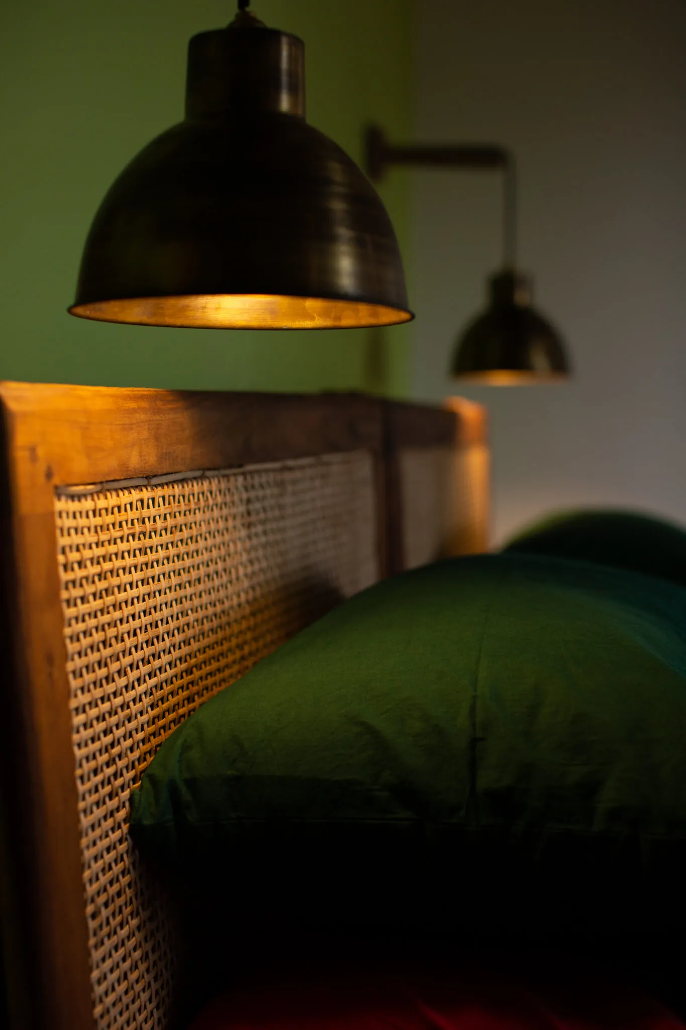 Reading lamp and cane bedhead detail at Casa Jaali