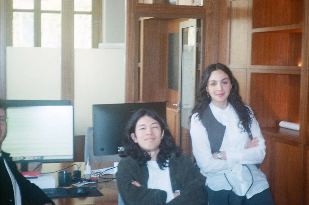 image of the CEO and an early hire at Uncovr ai in a vintage film camera style