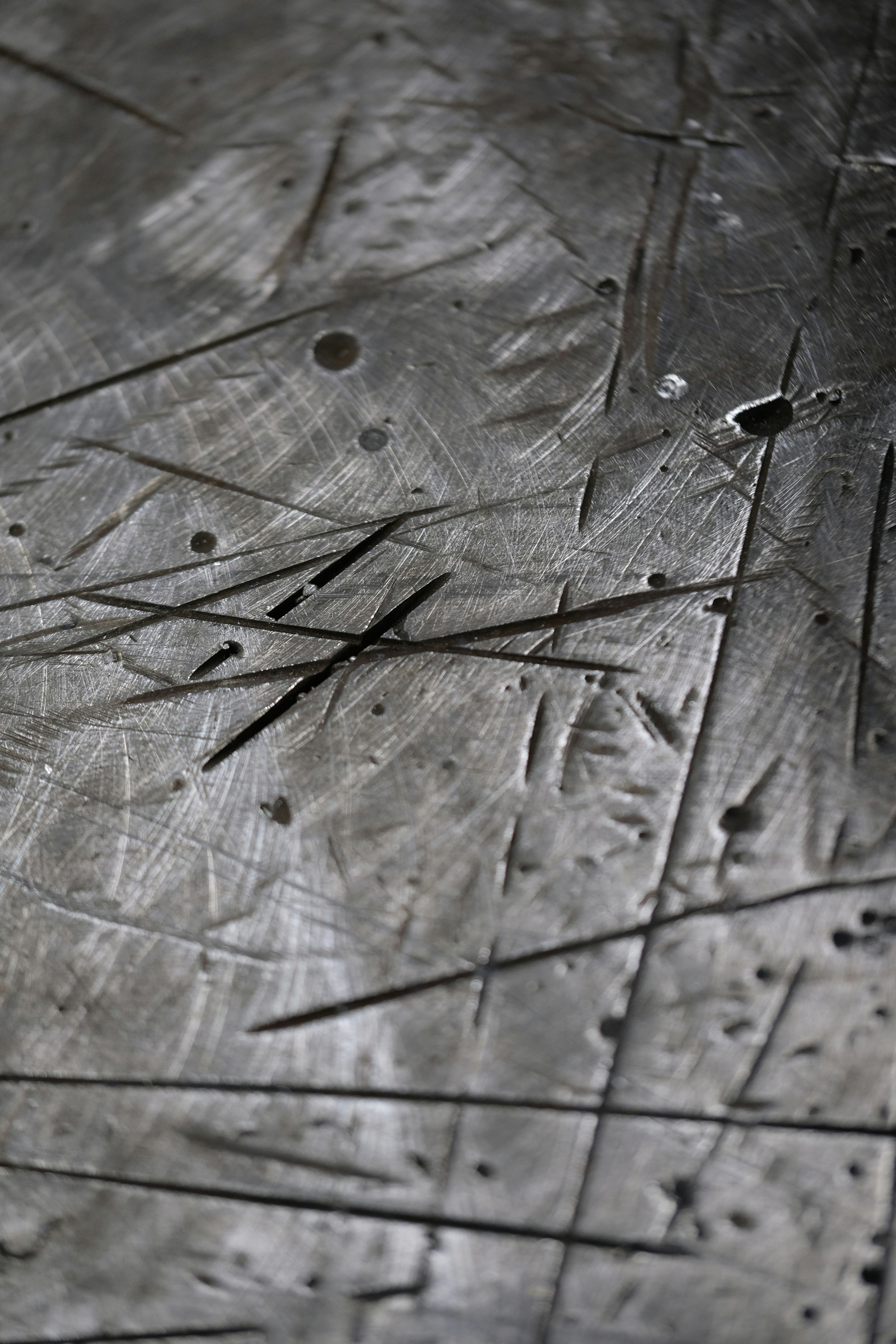 Scratched metal surface with textured details