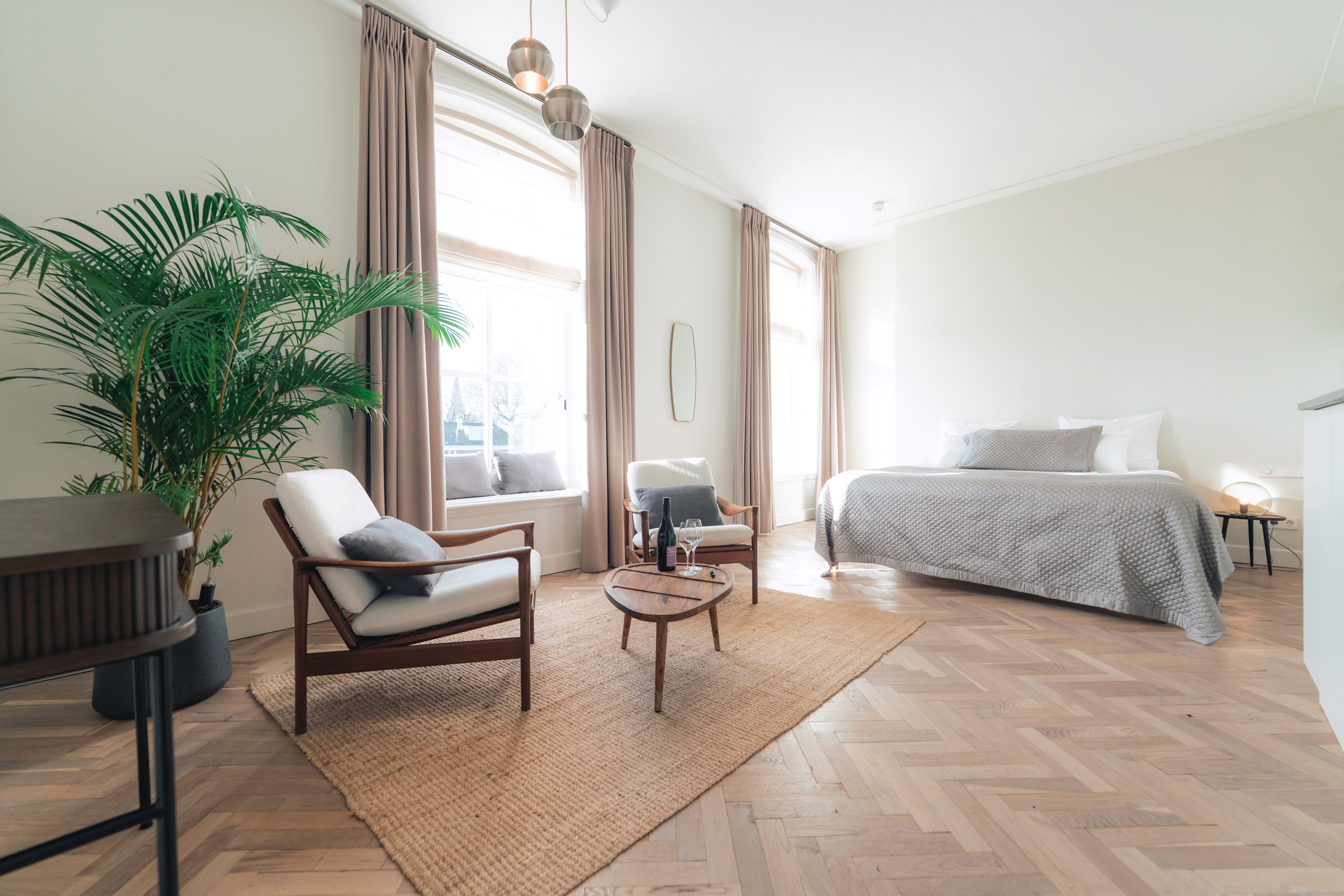 mountain valley with green grass and little village in the middle