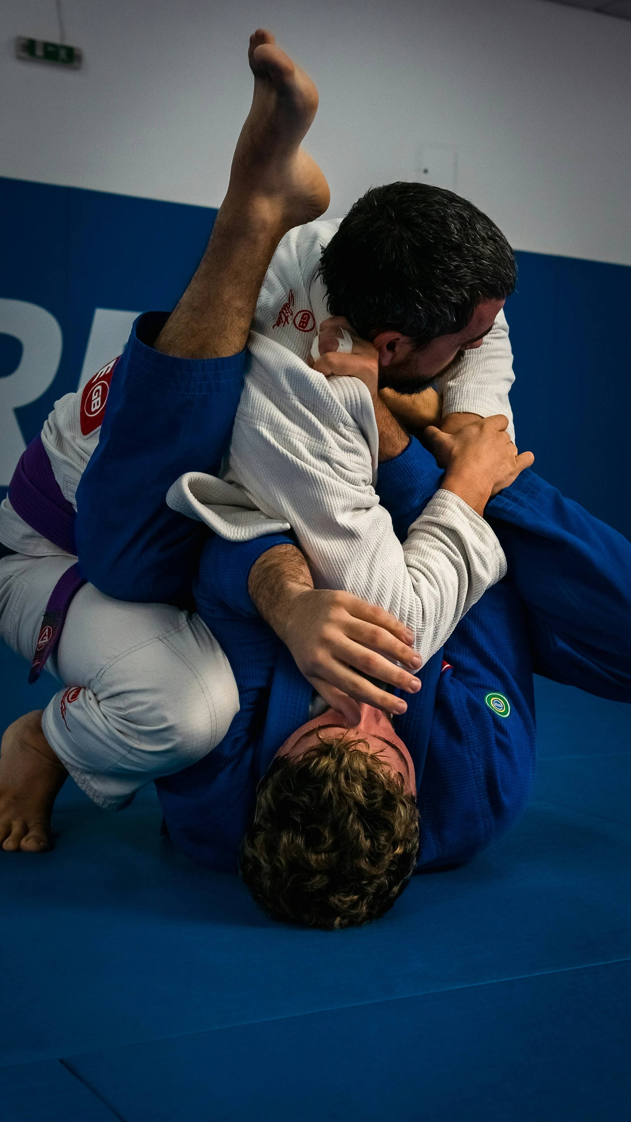 Brazilian Jiu-Jitsu students practicing grappling techniques at Rai Martial Arts.