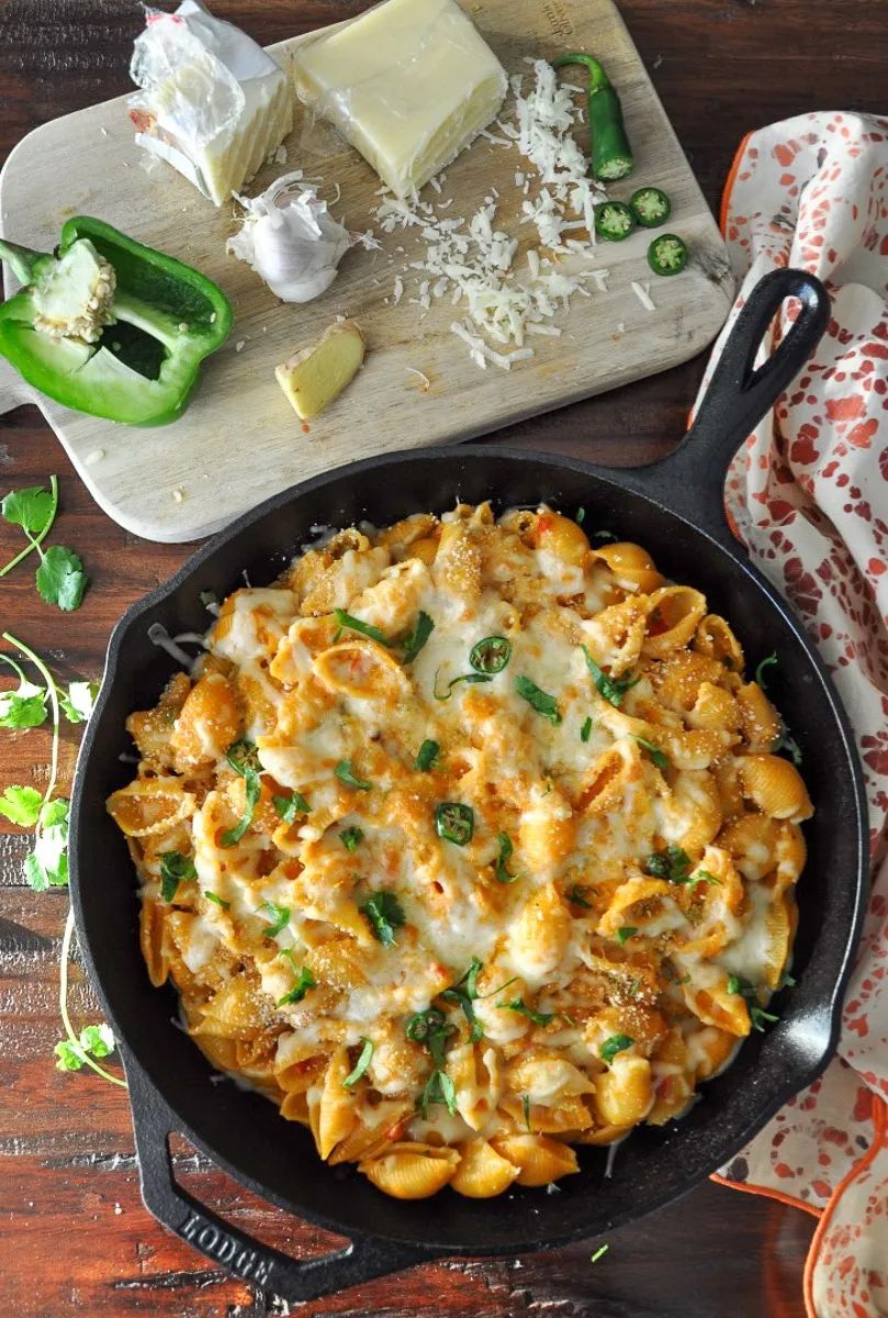 Oven-baked pasta casserole from PASTA 9 Toronto, creamy cheese-topped bake with herbs, the essence of comfort dining.