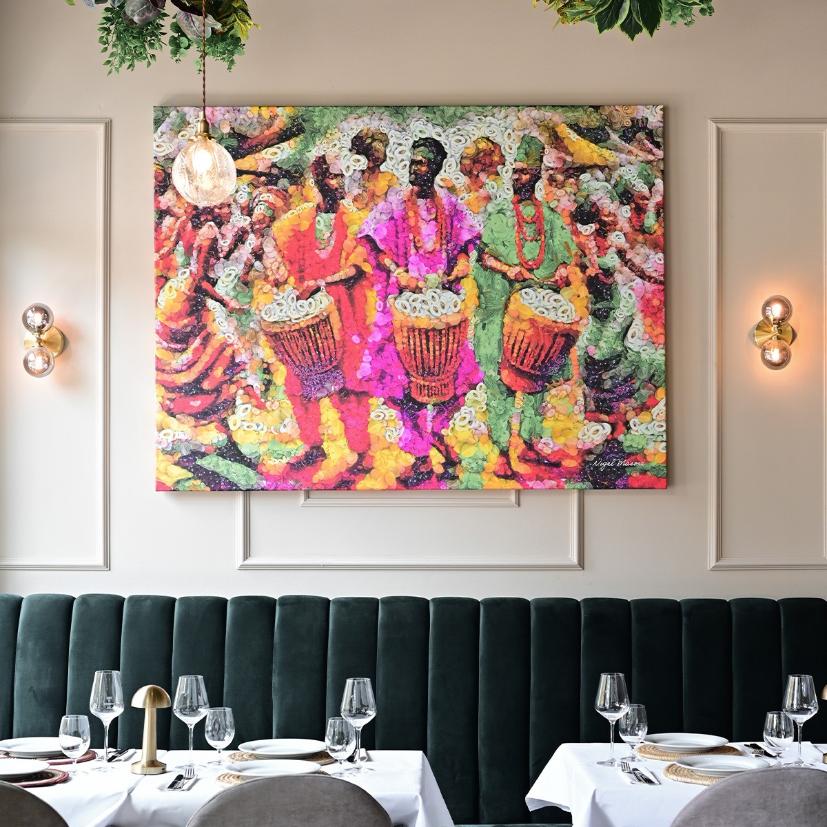 African man smiling and hard at work in the kitchen at Yajee - African & Caribbean Cuisine, preparing delicious dishes with dedication and skill.