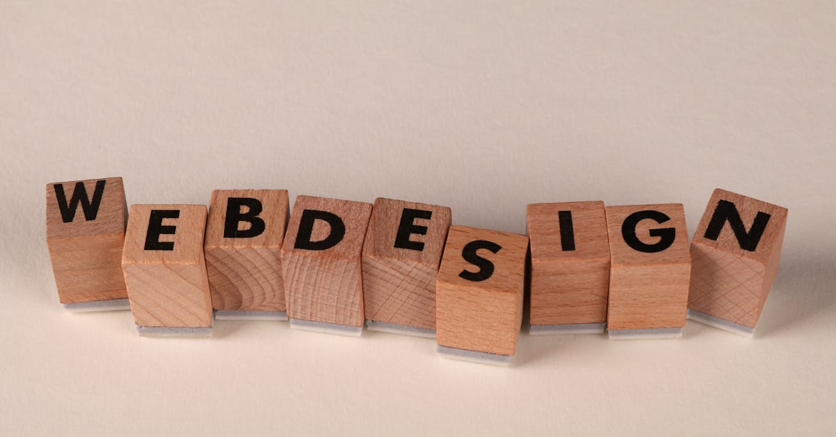 Wooden blocks spelling 'web design' creatively showcase digital design concept.