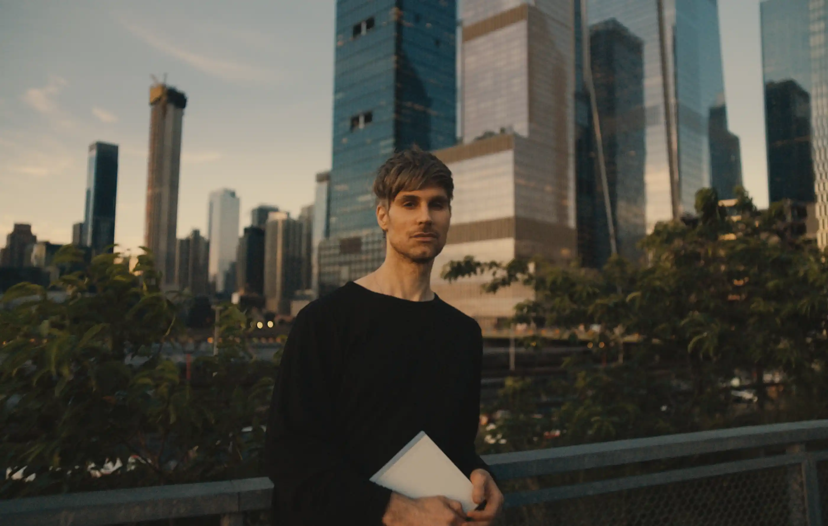 Architect Matthew Grzywinski holding his reMarkable tablet outdoors