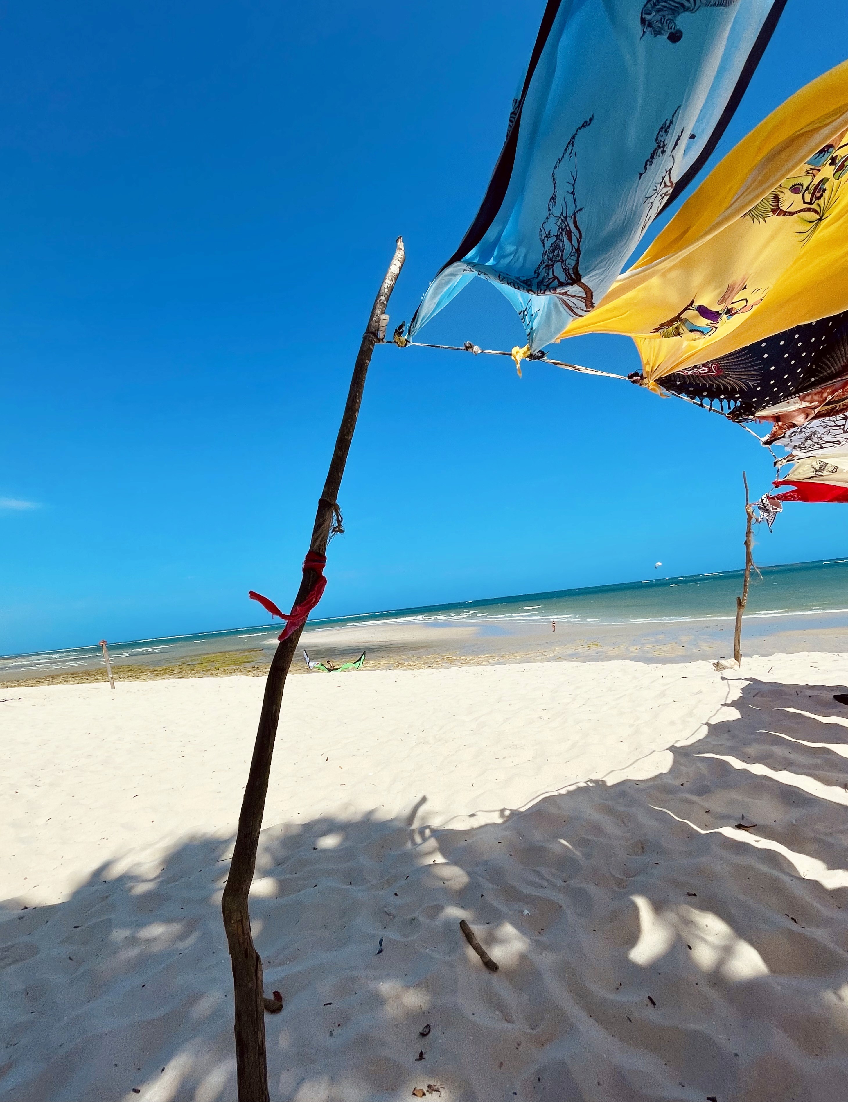 white umbrella on seashore