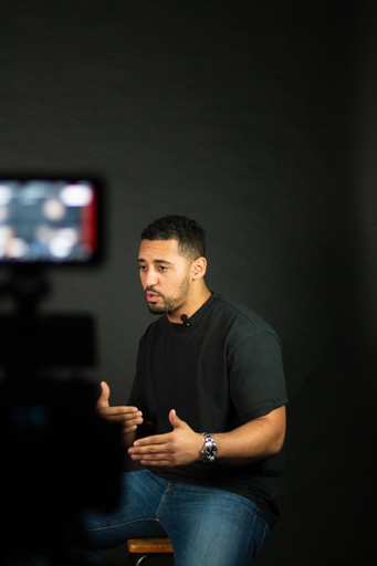 two people looking at a tablet and smiling