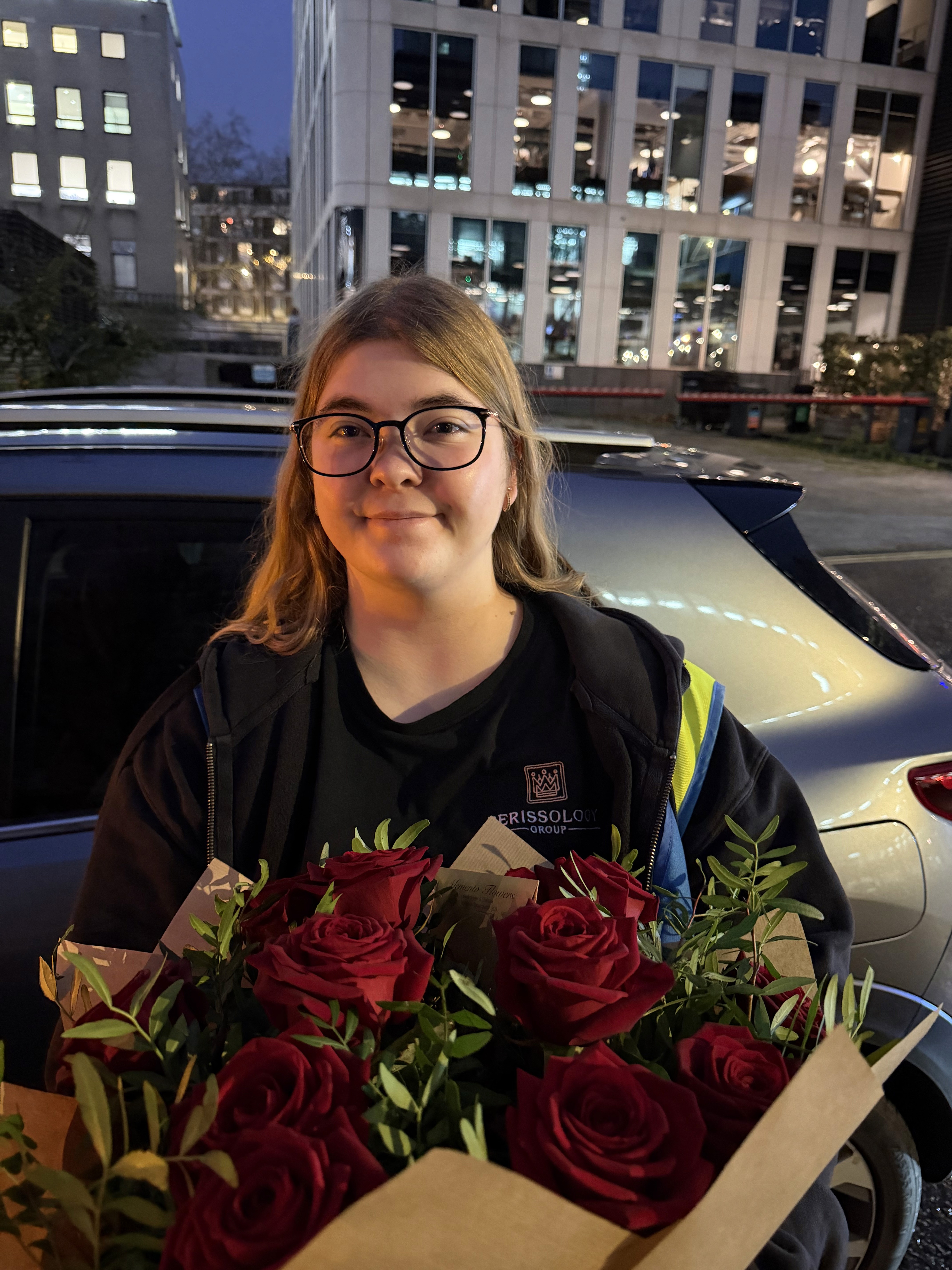 Perissology Courier Caitlin delivering roses