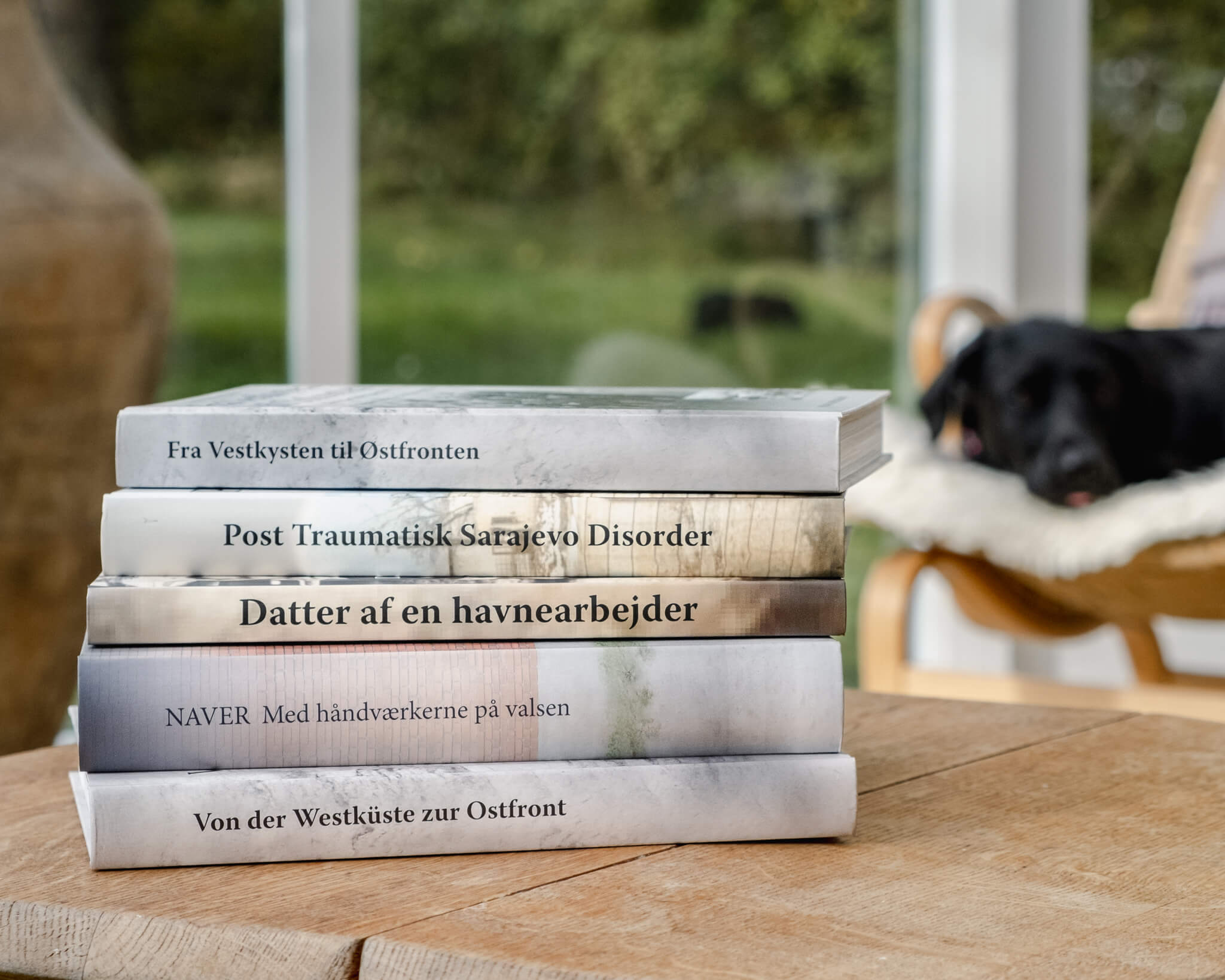A stand with books written by Suzi, in an orangerie