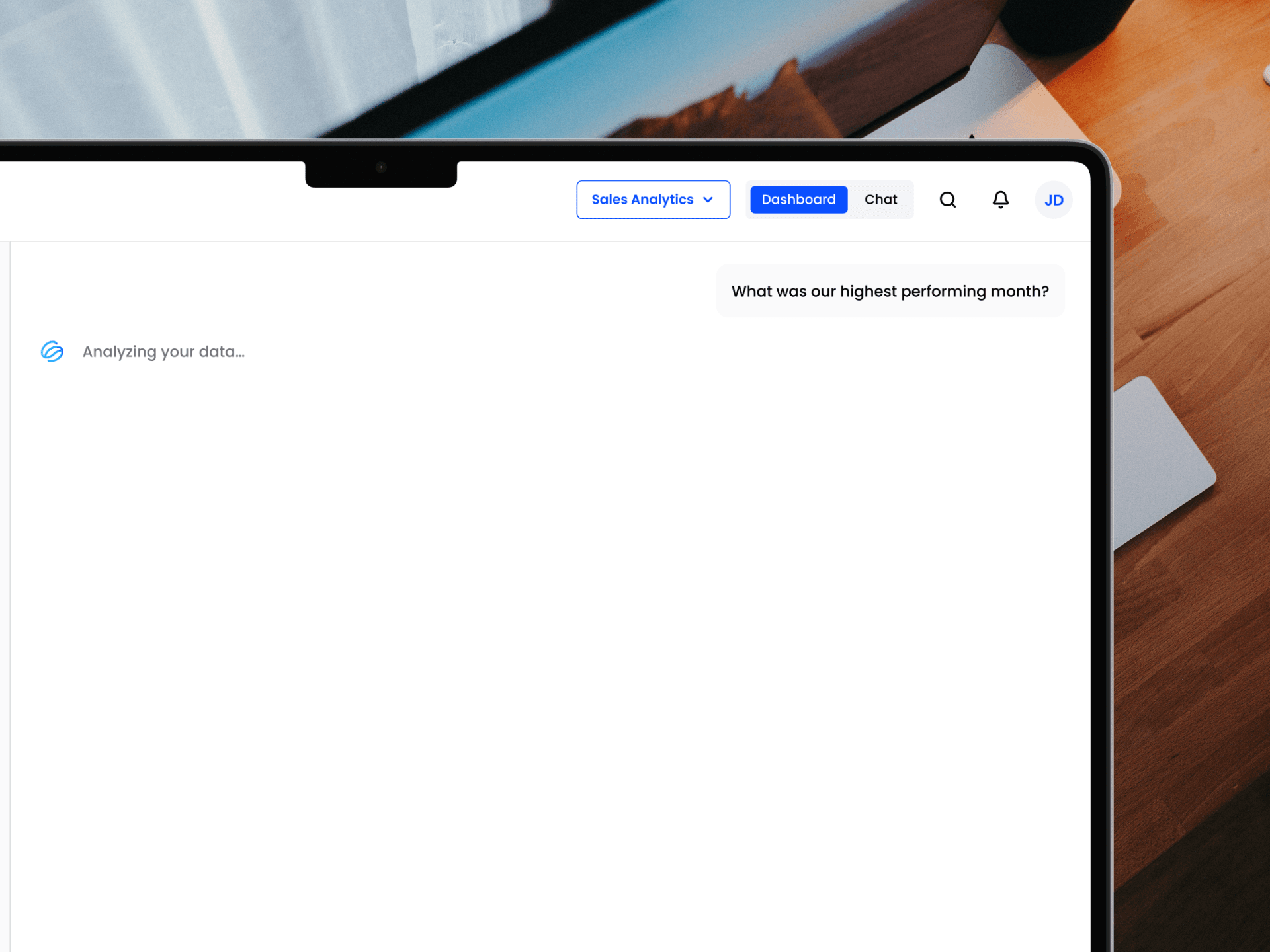 Screenshot of the Statspresso chat interface analyzing a sales data query on a laptop.