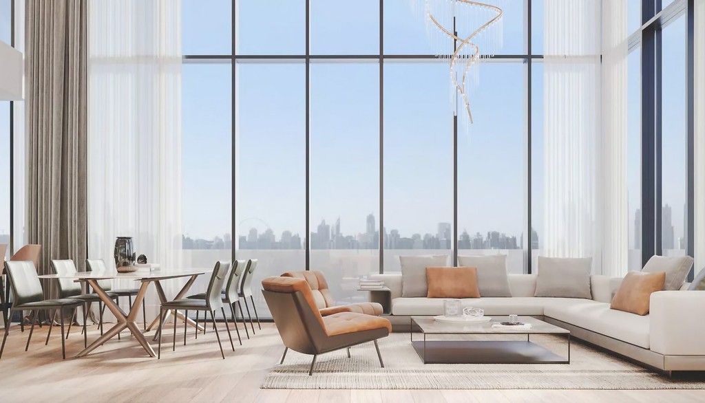 A stylish living room with a spacious window, highlighting a bright and airy atmosphere at The Orchard Place (260).