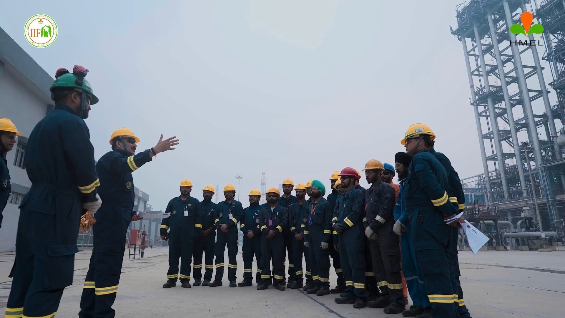 Snap from a video that we created for a client where the team lead is seen speaking motivational words to its workforce.