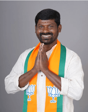 Full moon visible through silhouetted palm fronds at night.