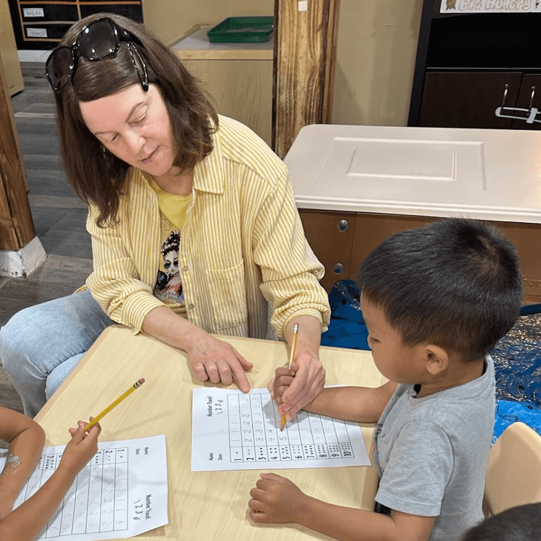 boy in black hoodie sitting on chair
