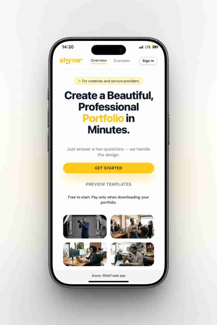 A smiling young man with crossed arms, wearing a plaid shirt and white t-shirt, poses against a dark background.