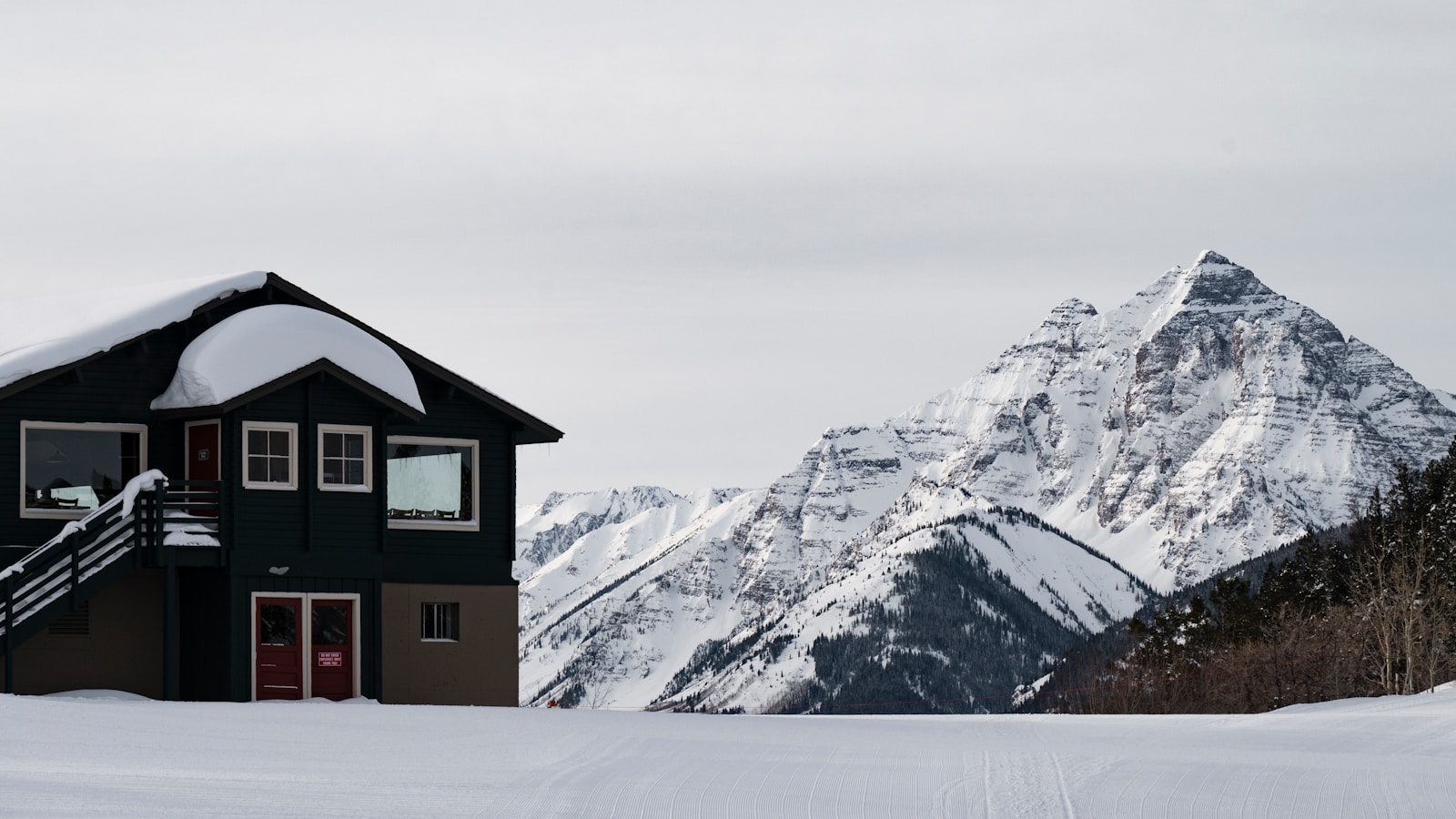 The Stone Archive mountain luxury home in snow