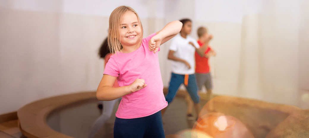 Students performing dynamic jazz funk choreography in after school dance enrichment program