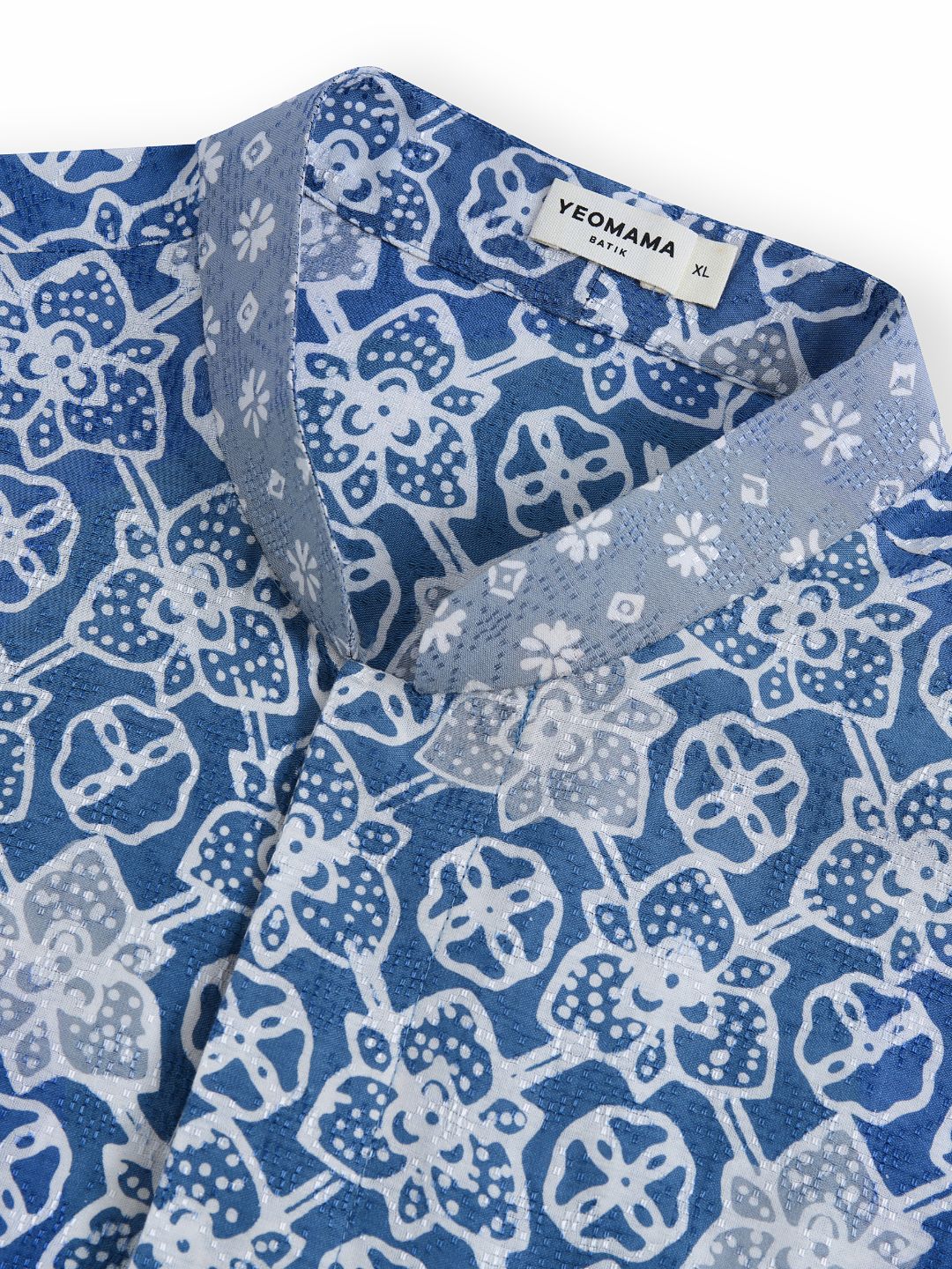 Photo of products from Yeomama® Batik, Mandarin Short Sleeve Shirt (Peranakan Petals - Blue), shot against a white background by JU Productions