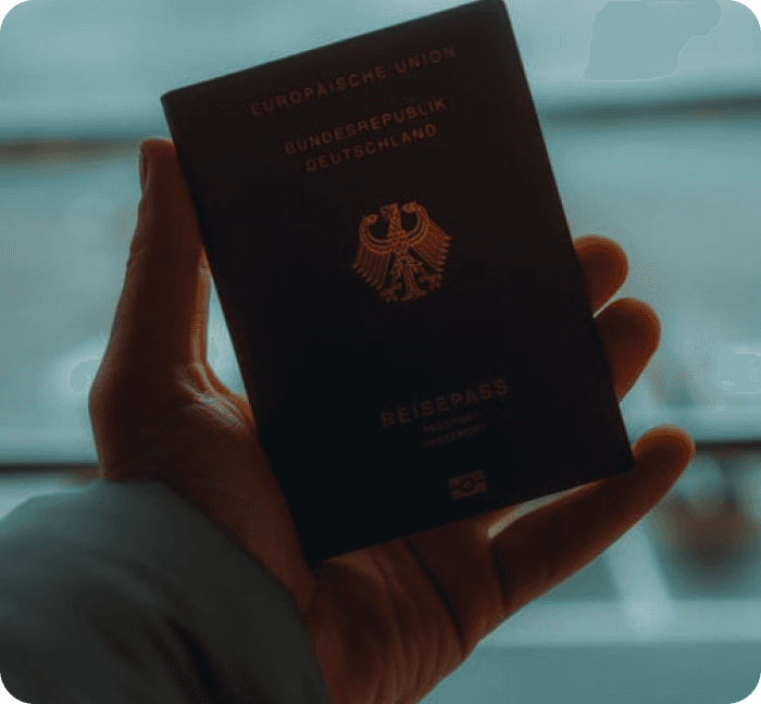 Hand holidng a country international passport