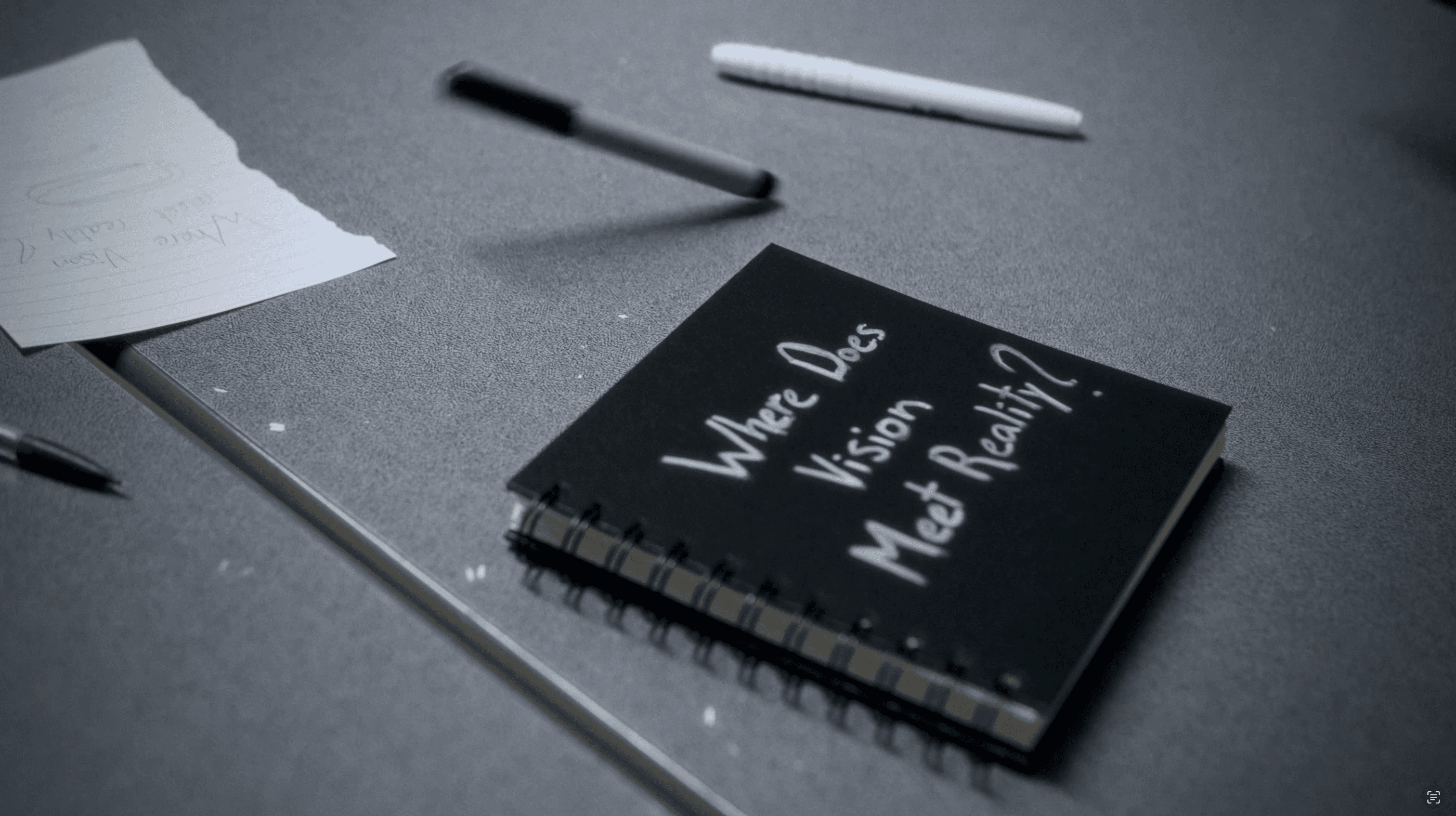 An image of a smartphone on top of an eletronic surface