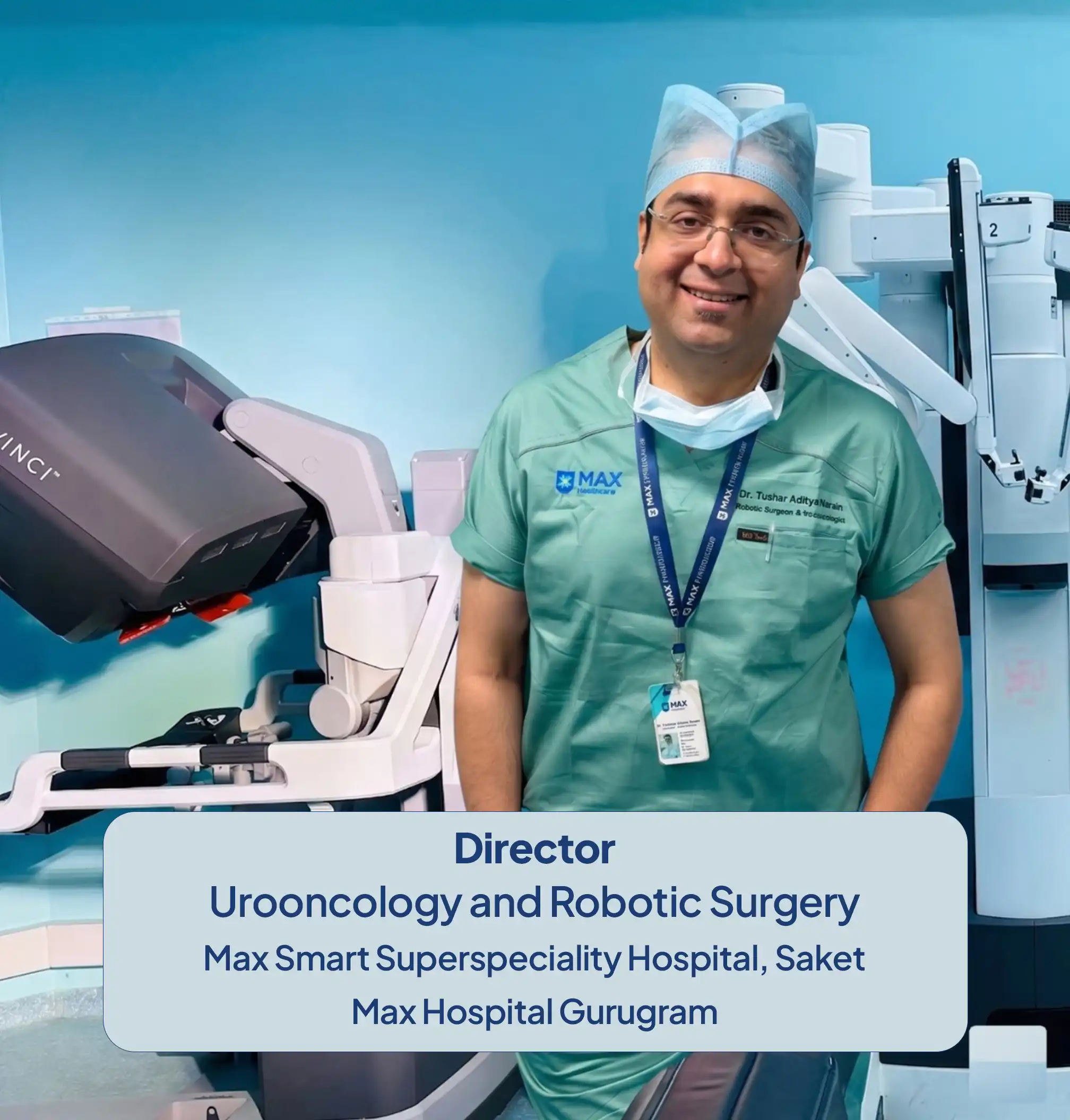 Dr. Tushar Aditya Narain, robotic urological oncologist, standing in surgical scrubs beside the da Vinci Xi robotic system inside the operating room at Max Hospital, Saket.