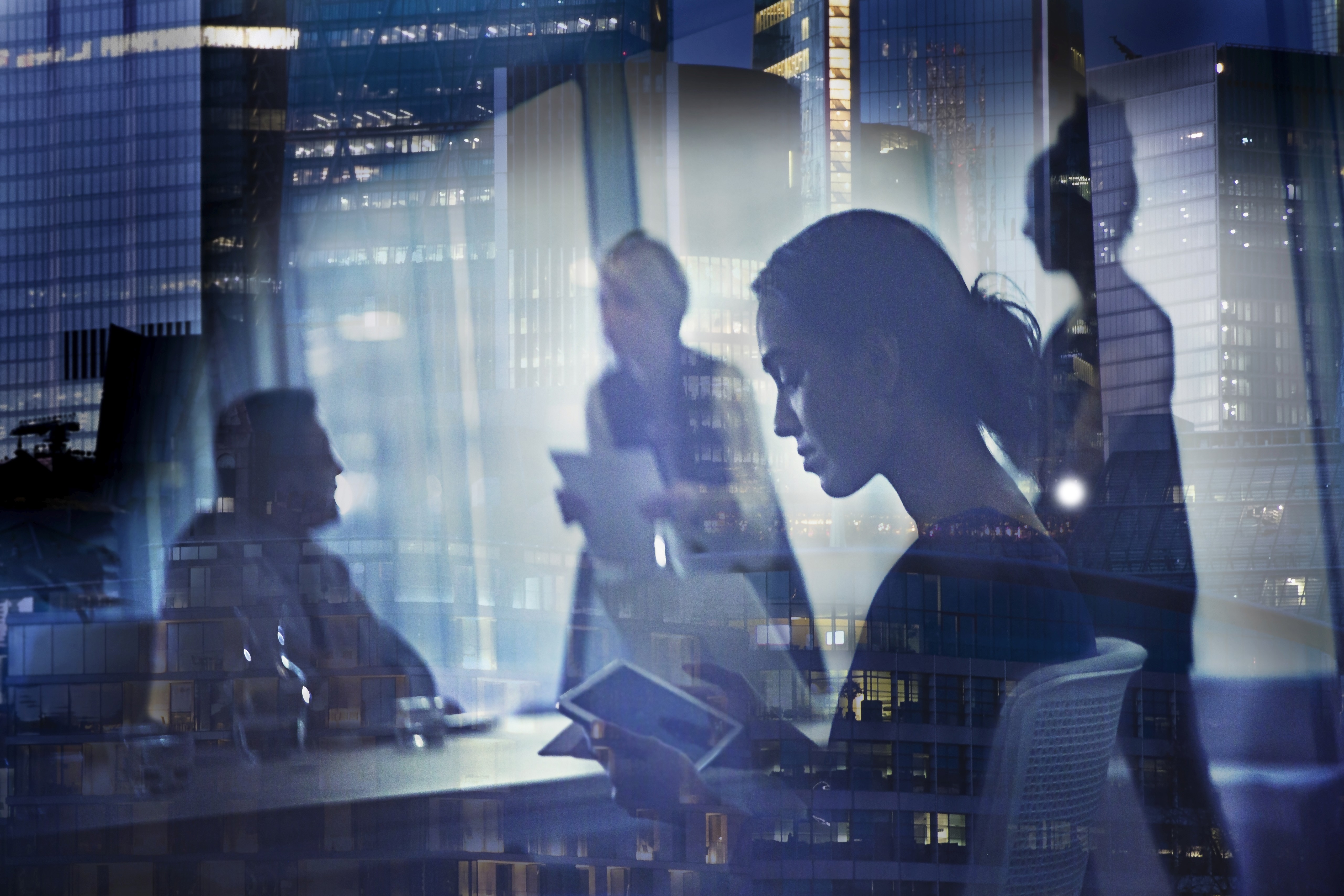 people in conference room with glass walls