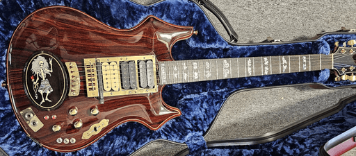 Rosebud in case by Scarlet Fire Guitars