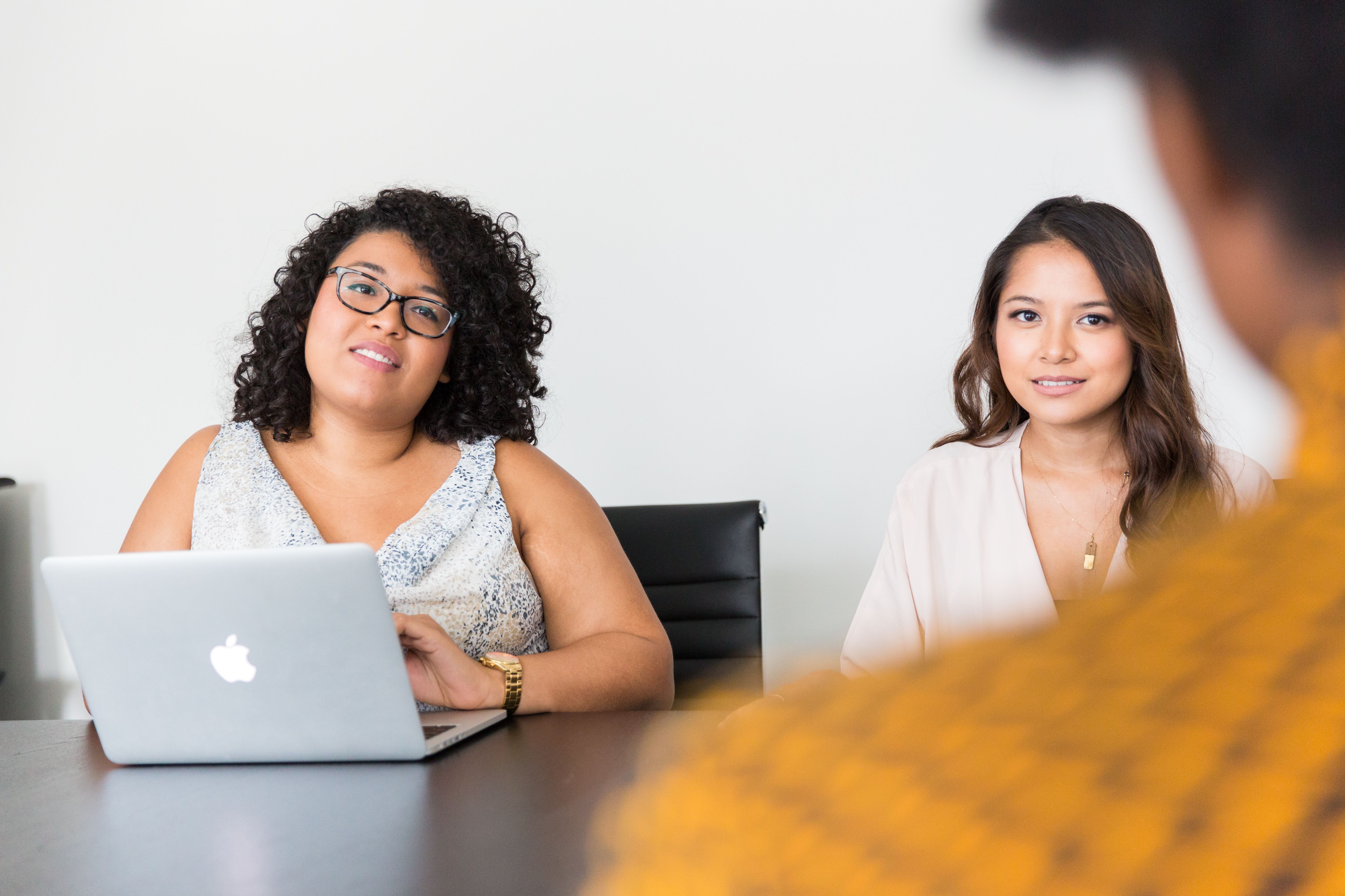 diverse-women-engaged-in-a-business-meeting-with-laptop,-showcasing-teamwork-and - christina-morillo (pexels)